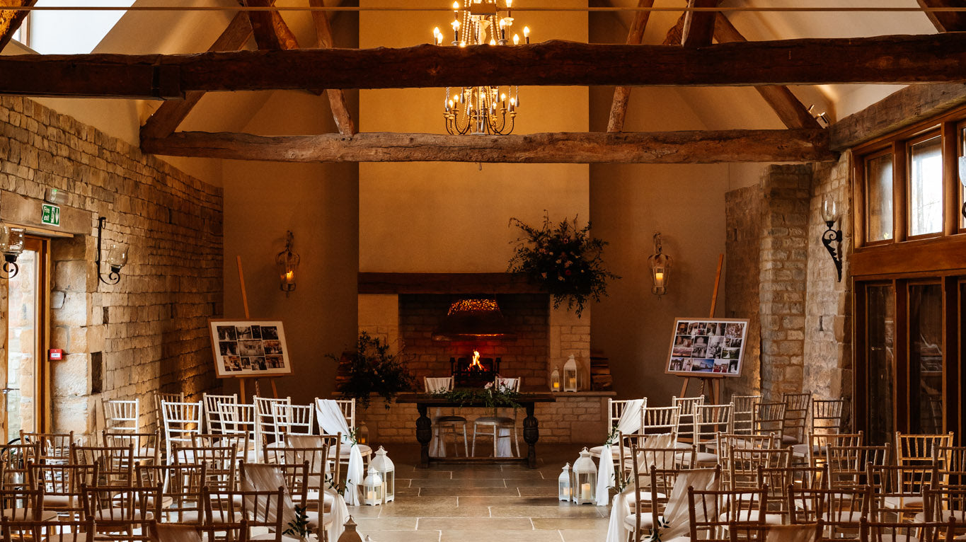 Blackwell grange ceremony room set up with a red, blush and greenery feel