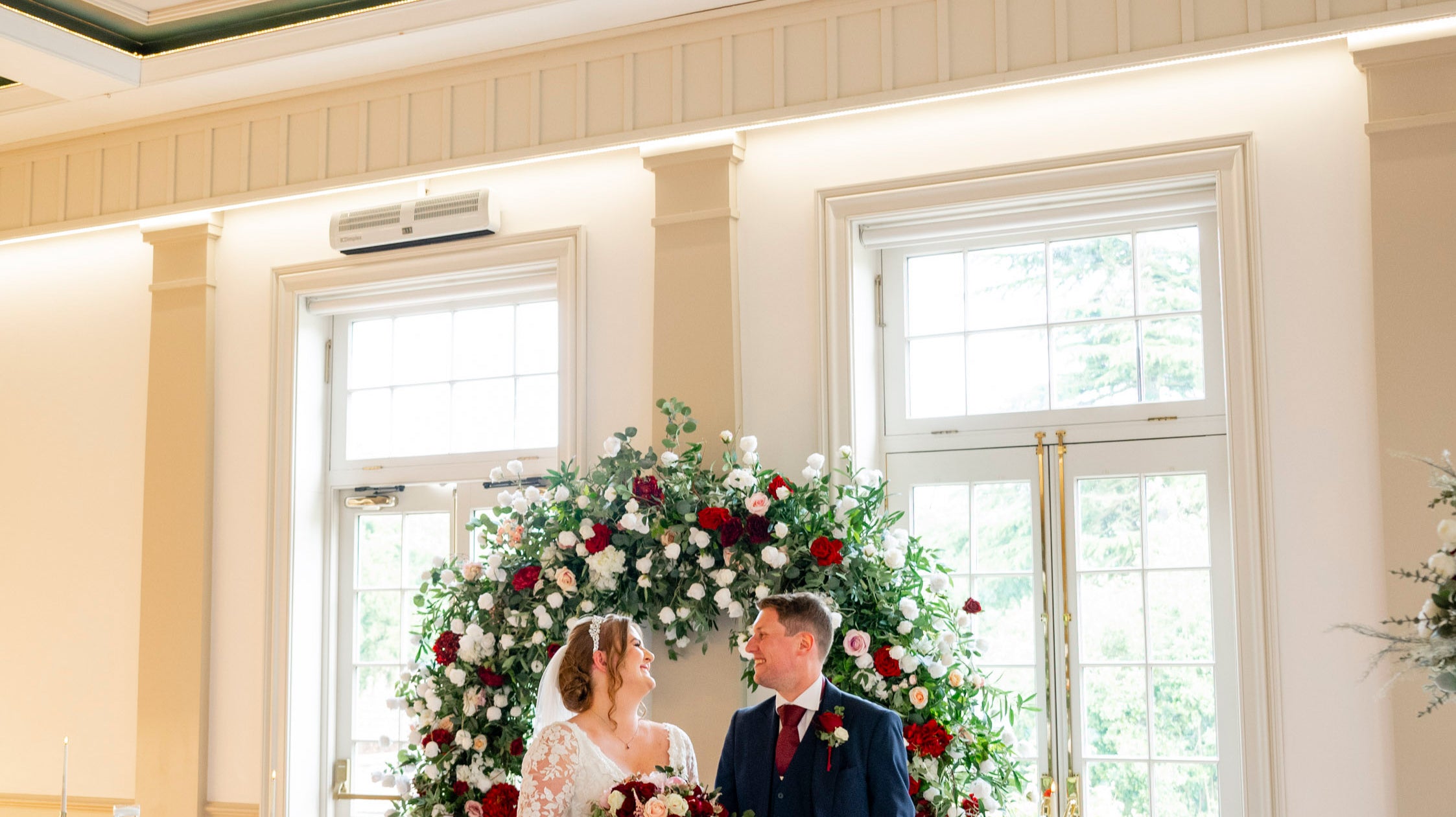 Bride and groom at hodsock priory, with a burgundy and blush wedding theme