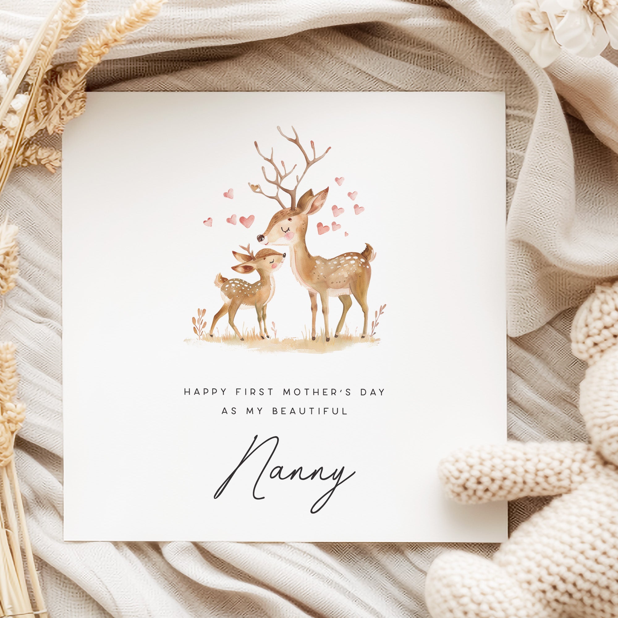Greeting card with deer illustration and text on a soft fabric background