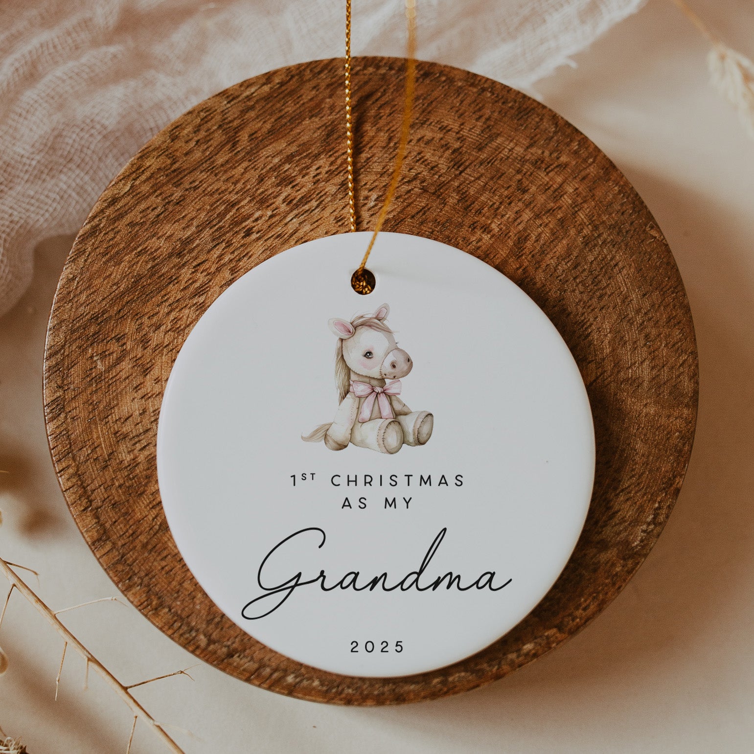 Decorative ornament with a baby pony illustration and text on a wooden base.