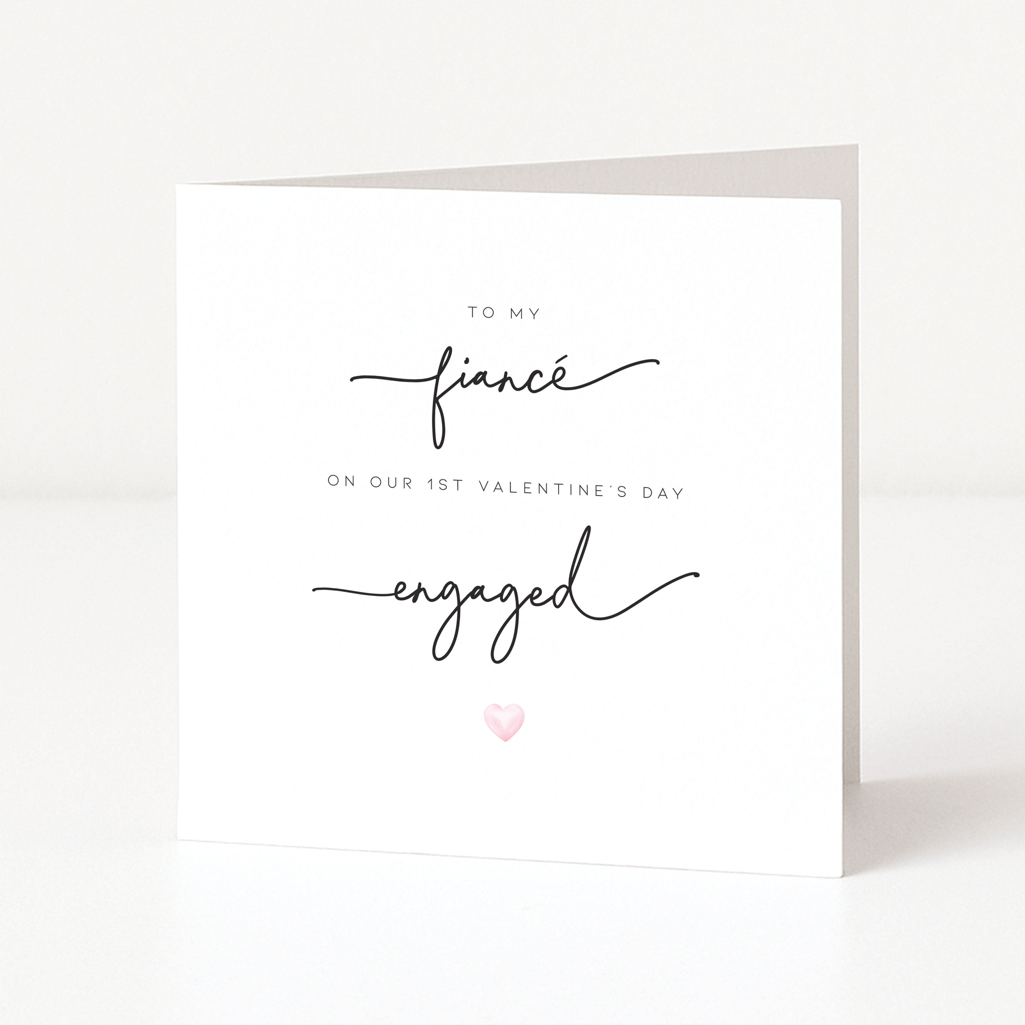 Greeting card with 'To my fiancé on our 1st Valentine's Day, engaged' text on a white background