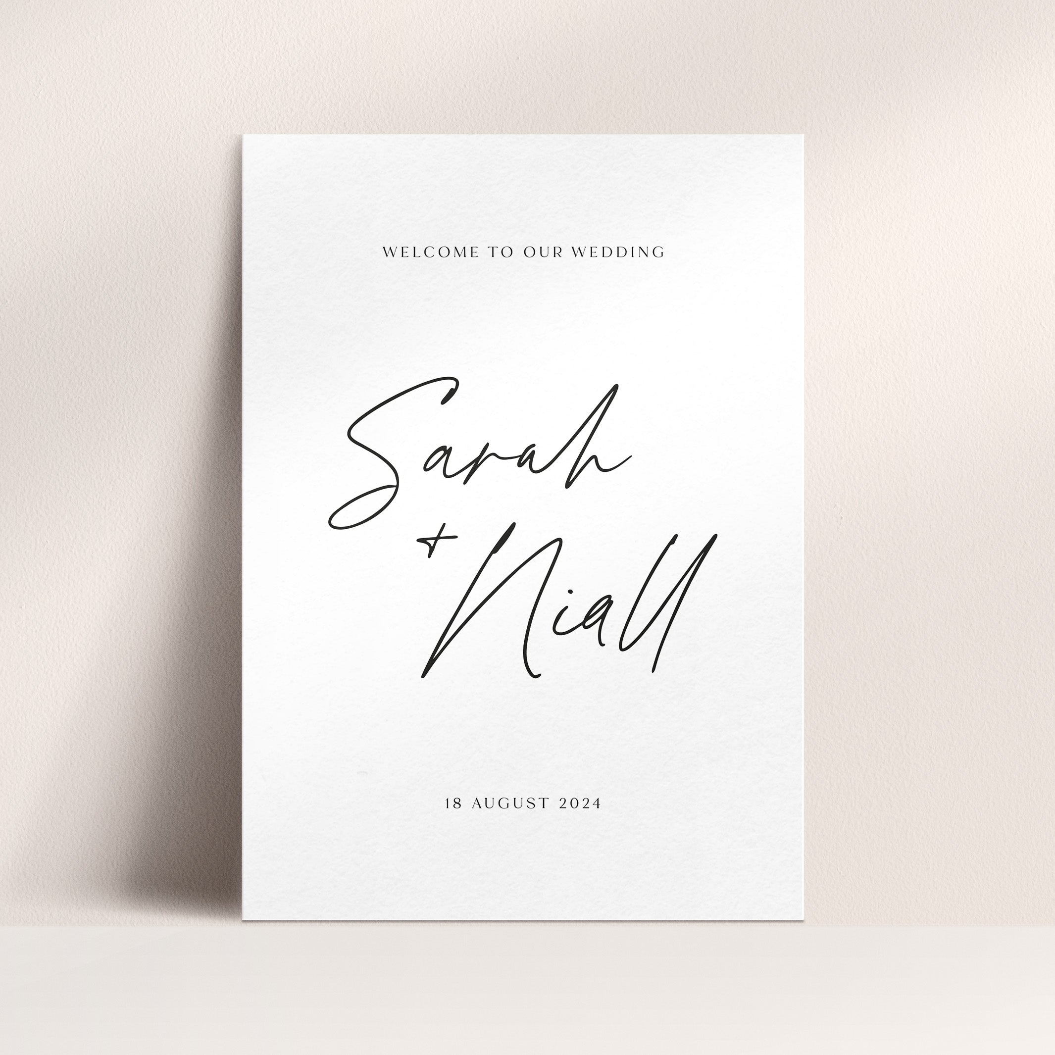 Wedding welcome sign with 'Sarah & Niall' on a beige background
