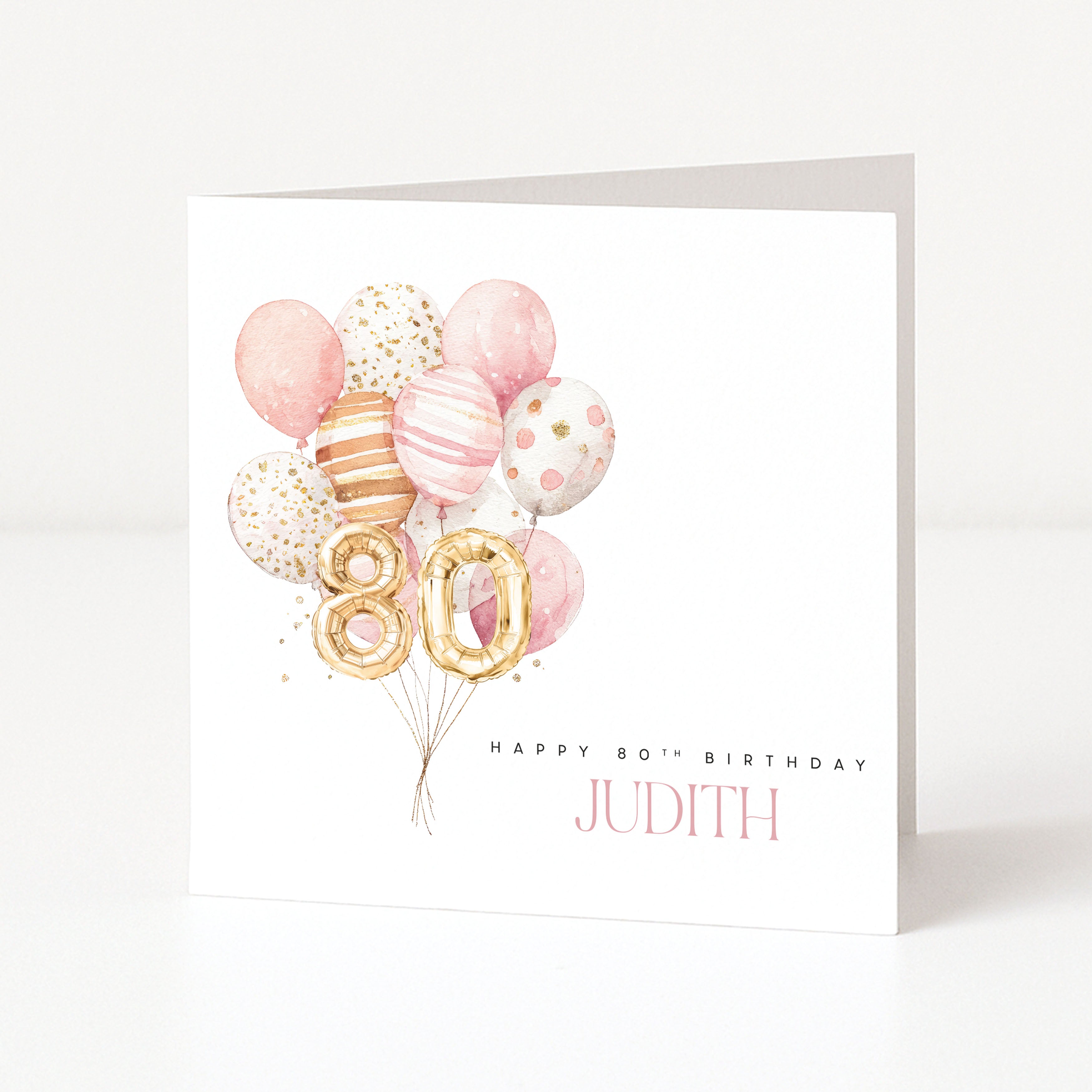 Personalised 80th birthday card for Judith with gold 80 balloons and a pink watercolour balloon cluster.