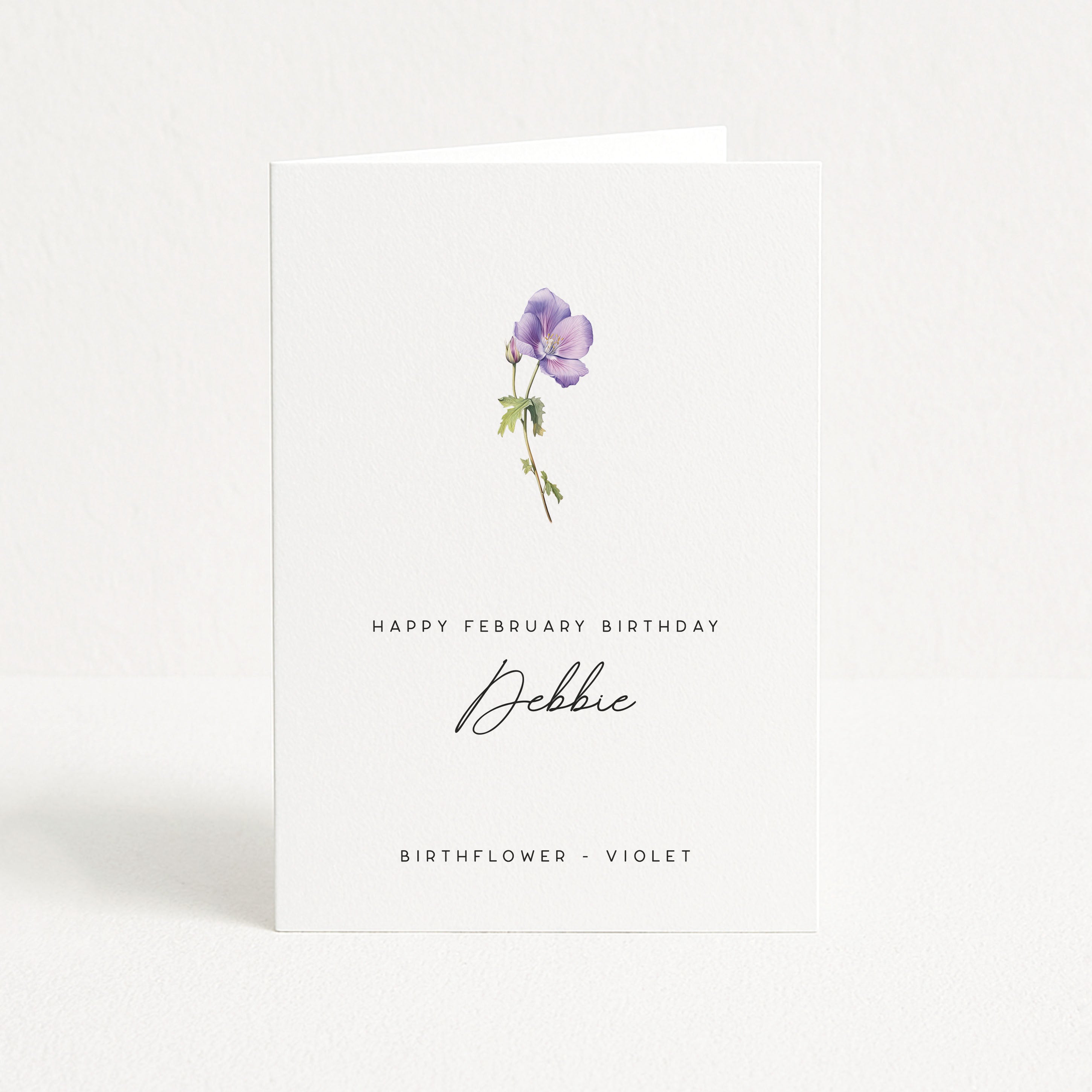 Greeting card with a purple violet flower illustration and personalized text on a white background