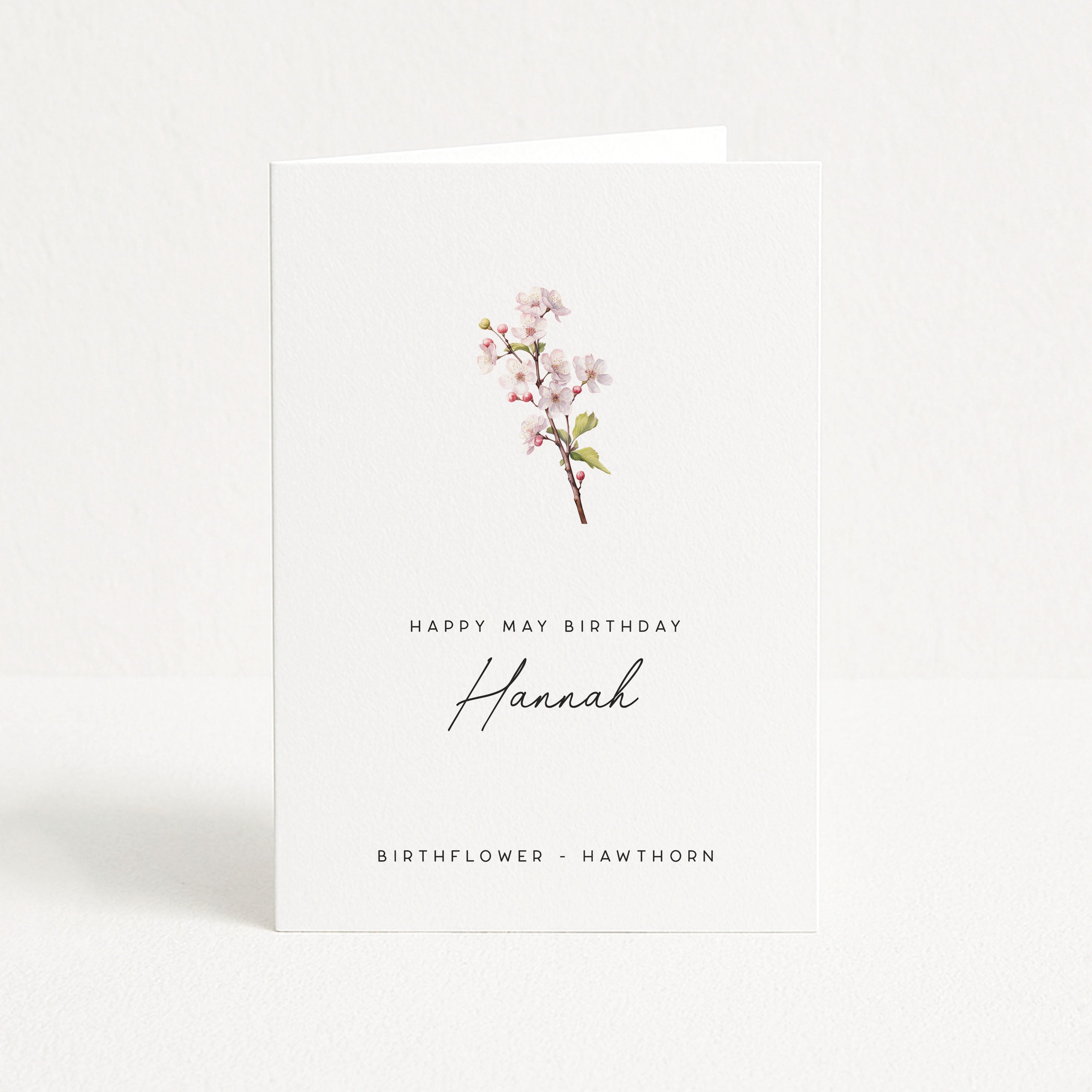 Greeting card with a hawthorn branch and text on a white background
