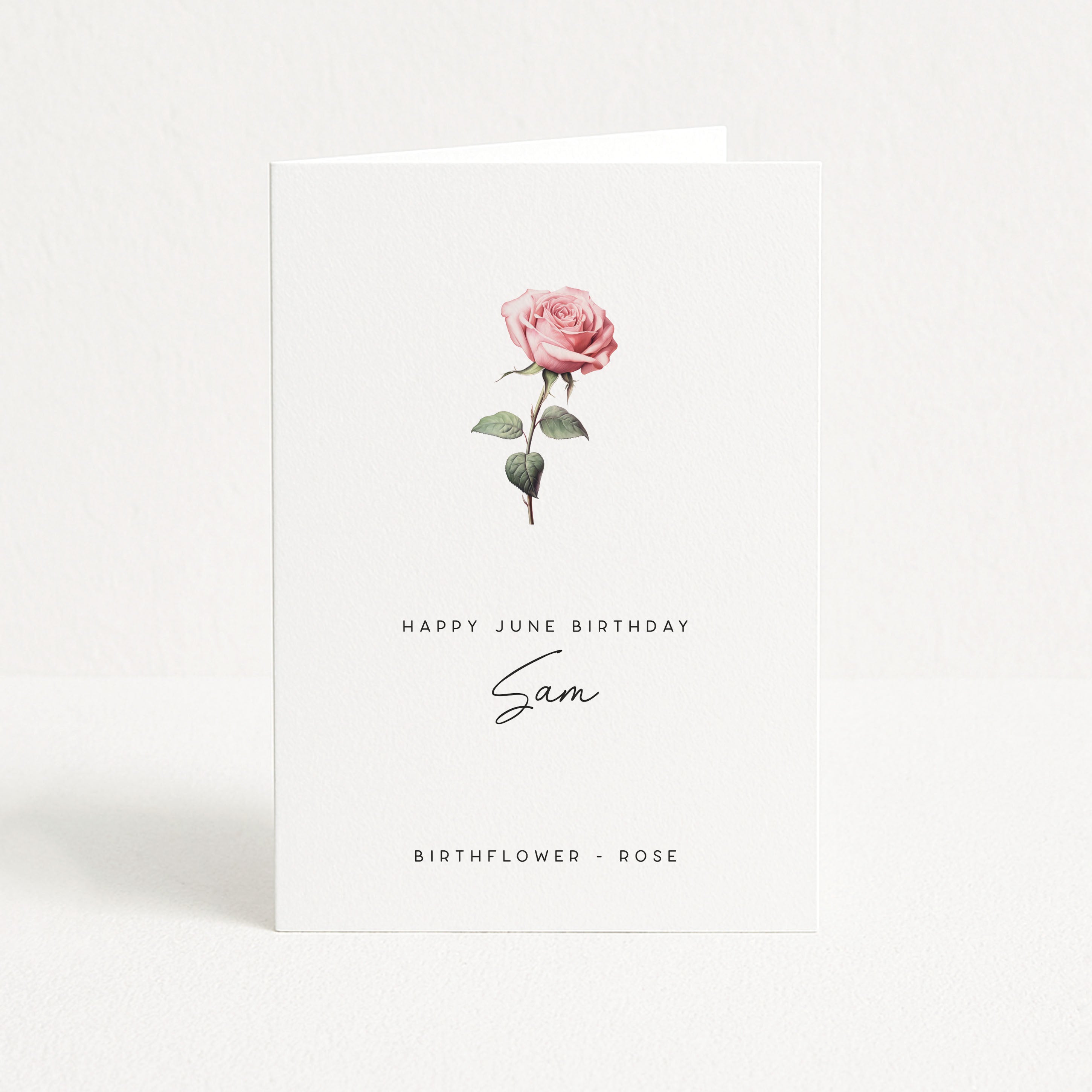 Greeting card with a pink rose and text on a white background