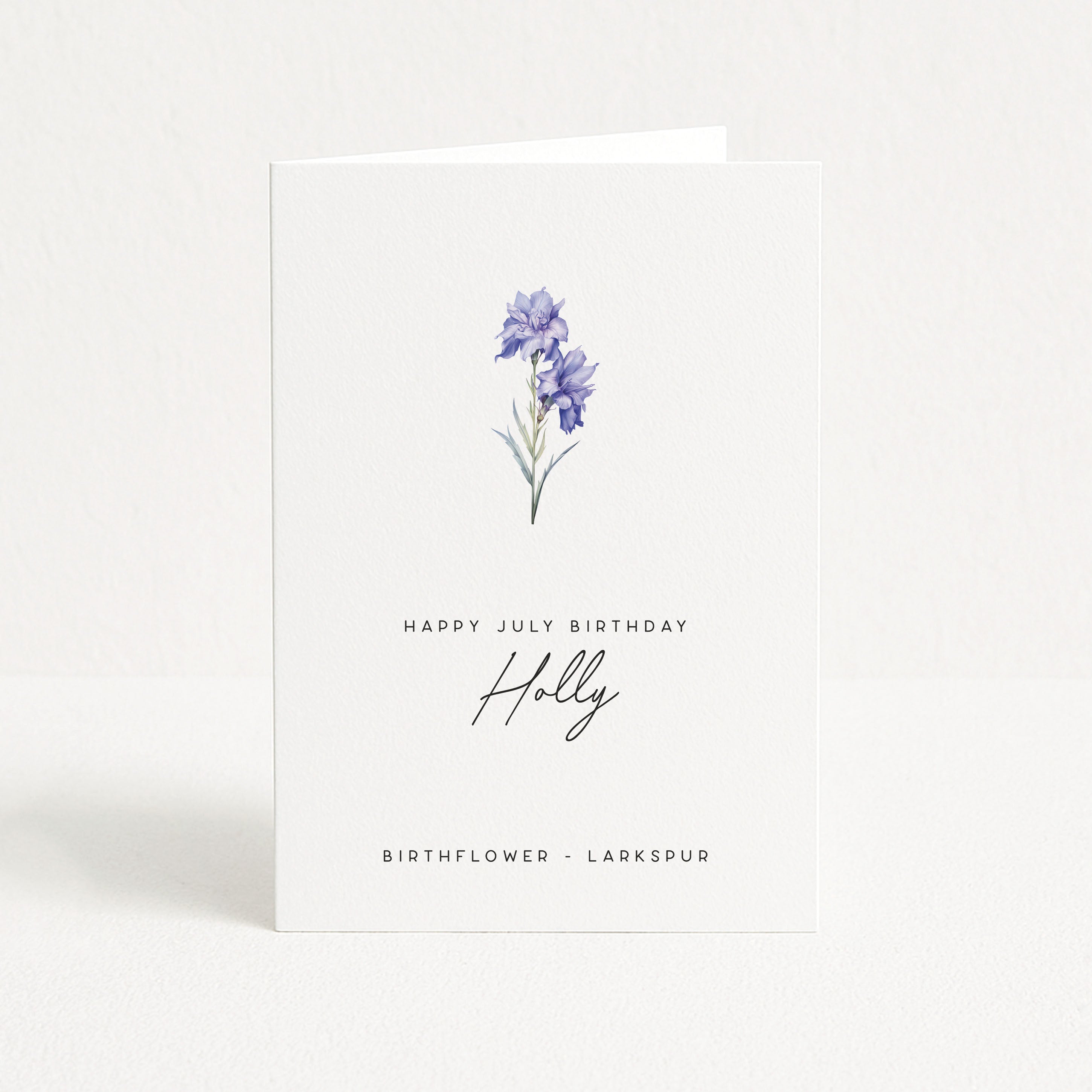 Greeting card with a watercolor illustration of larkspur flowers and text on a white background
