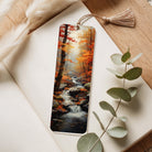 Bookmark with autumn forest design on a wooden surface with eucalyptus leaves