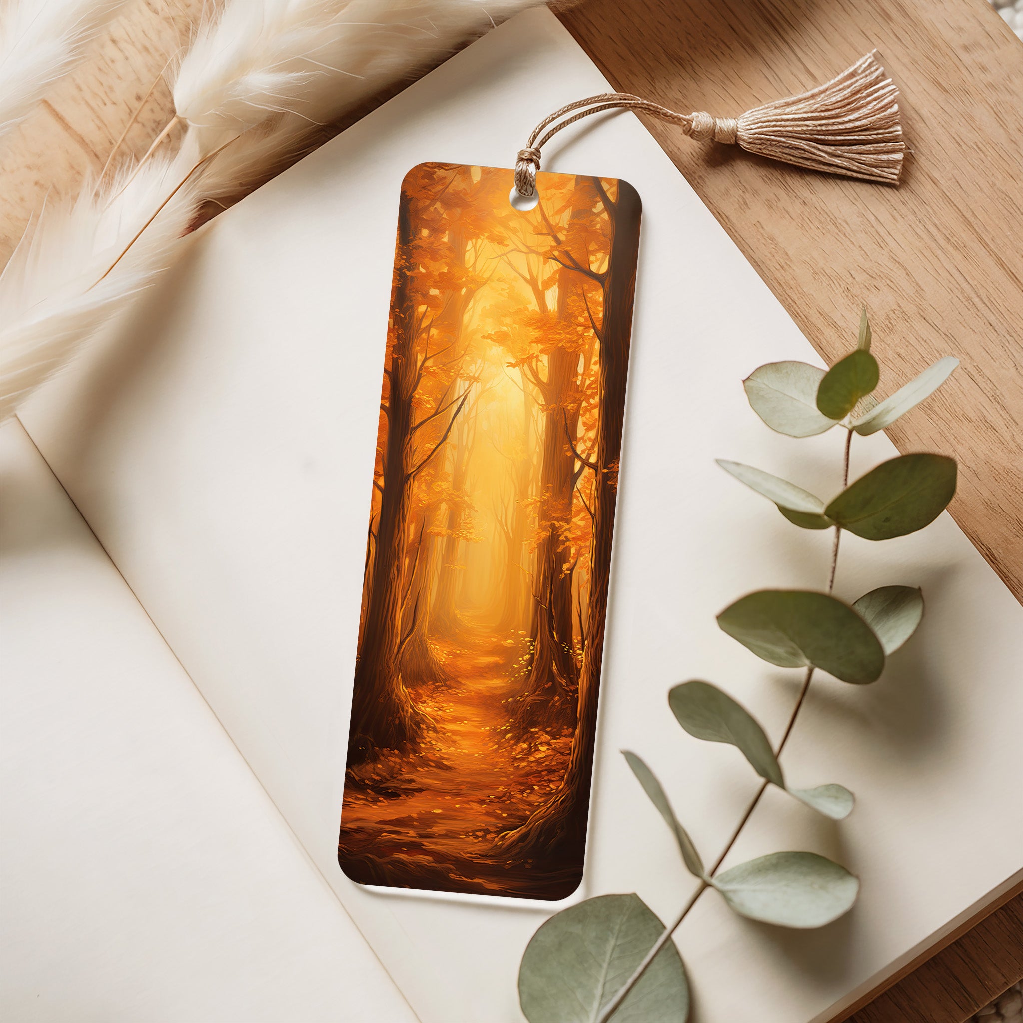 Acrylic bookmark with forest design on a notebook with eucalyptus leaves