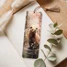 Bookmark with a bear design on a wooden surface with eucalyptus leaves