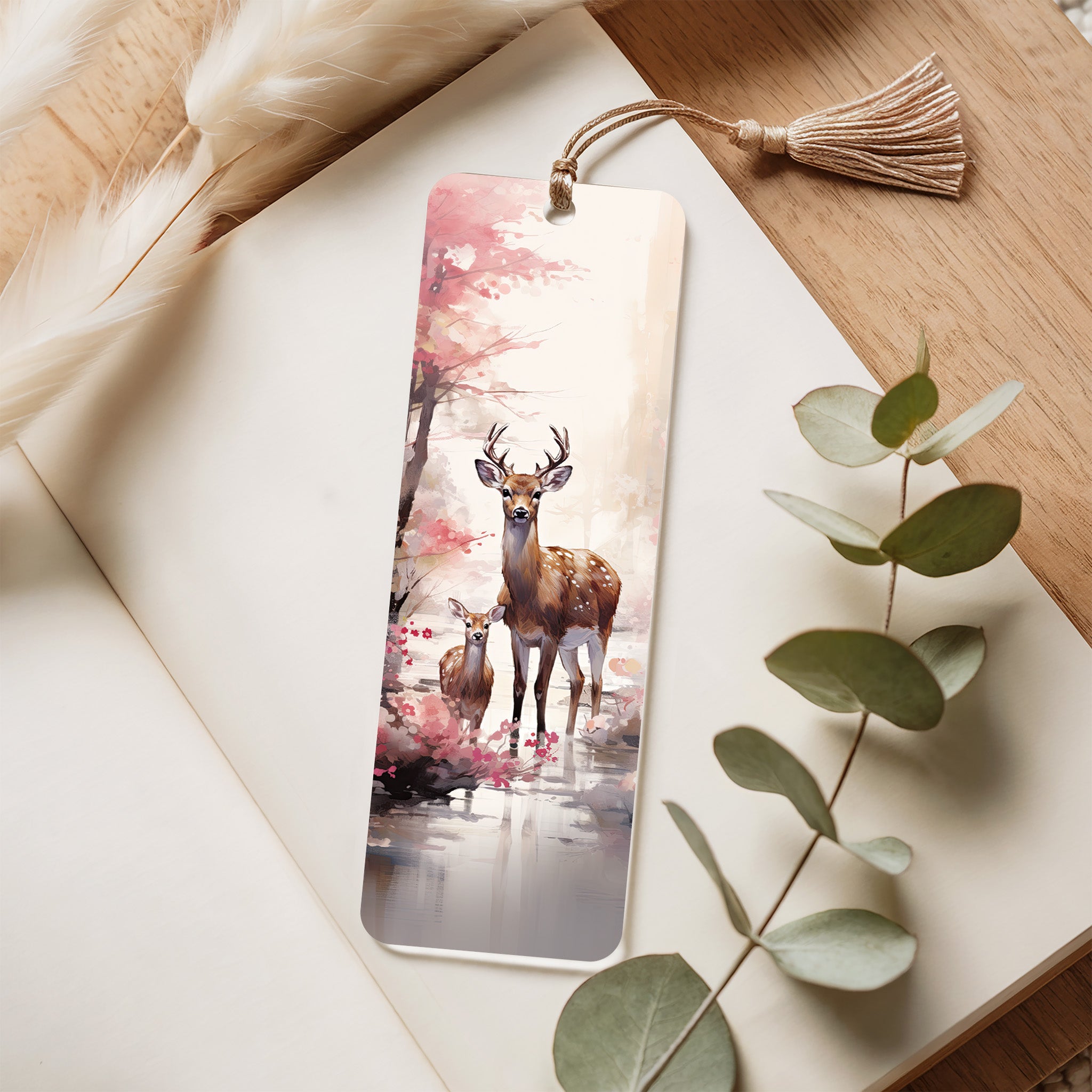 Bookmark with deer design on a notebook with eucalyptus leaves