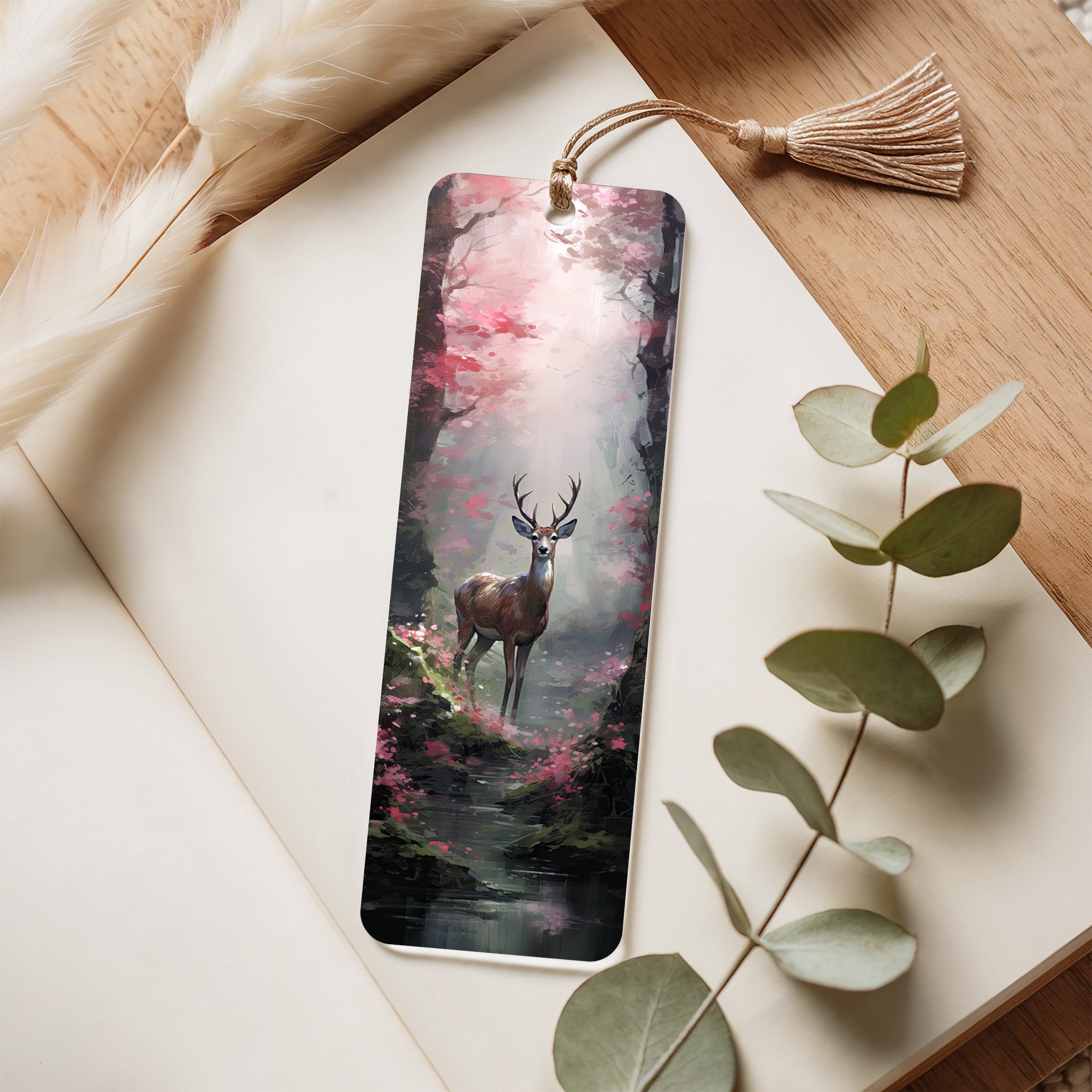 Bookmark with deer design on a wooden surface with leaves