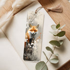 Bookmark with a fox design on a wooden surface with eucalyptus leaves