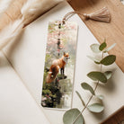 Bookmark with a fox design on a white surface with eucalyptus leaves