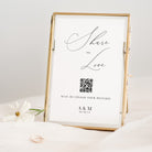 Framed print with 'Share the Love' text and QR code on a white background