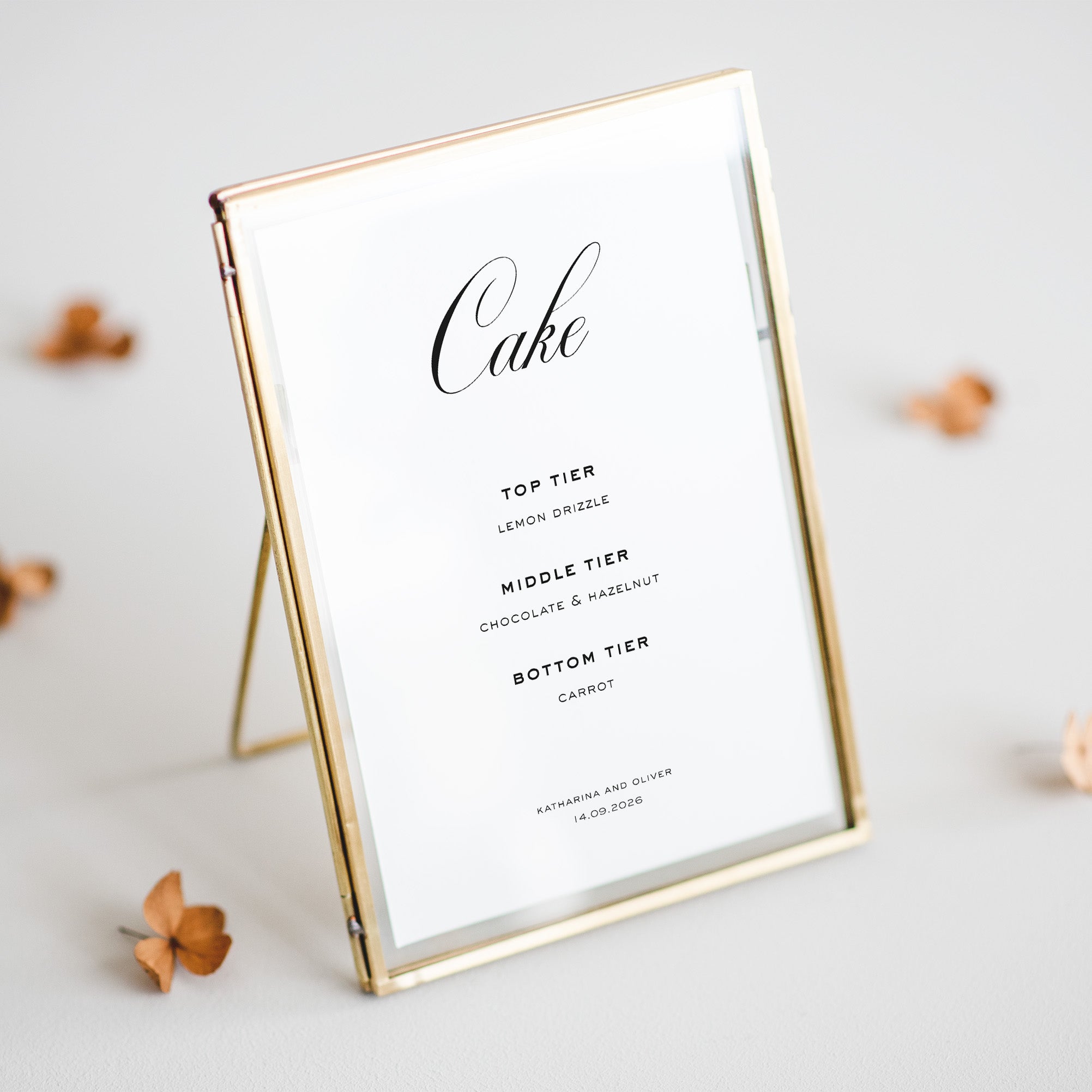Cake tier details on a white card with gold frame