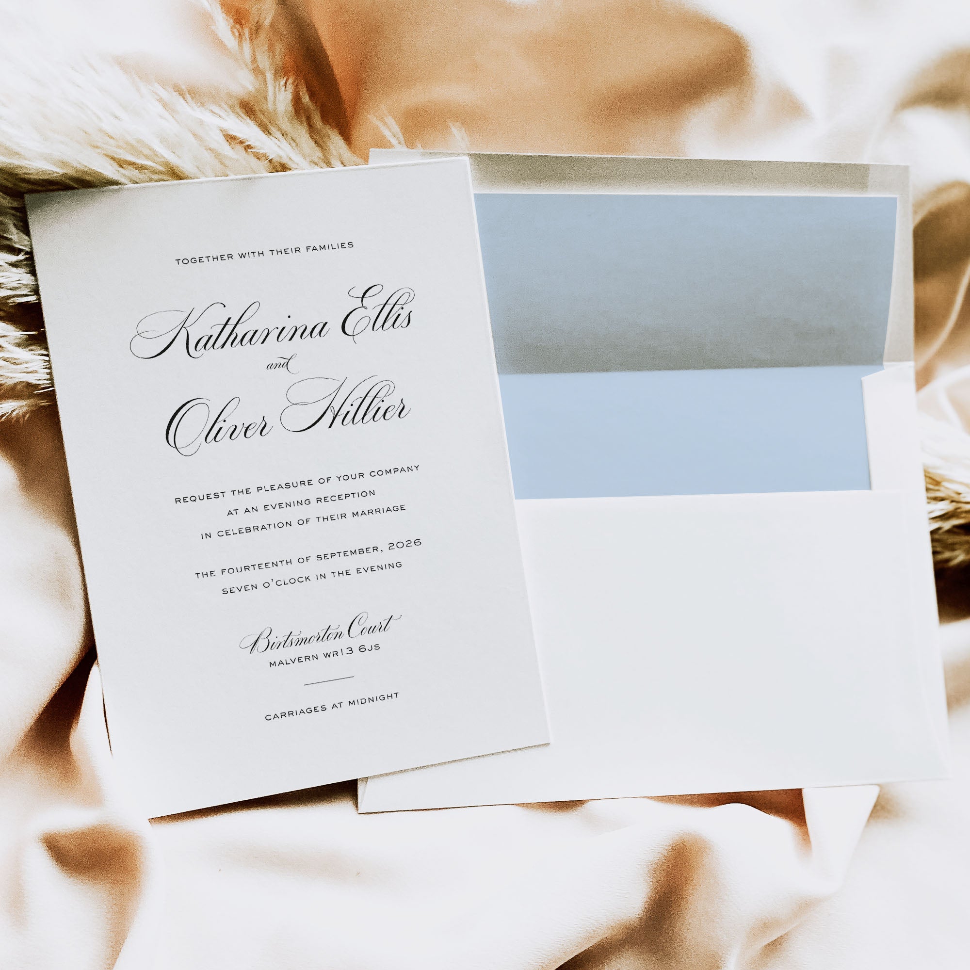 Wedding invitation card on a soft fabric background