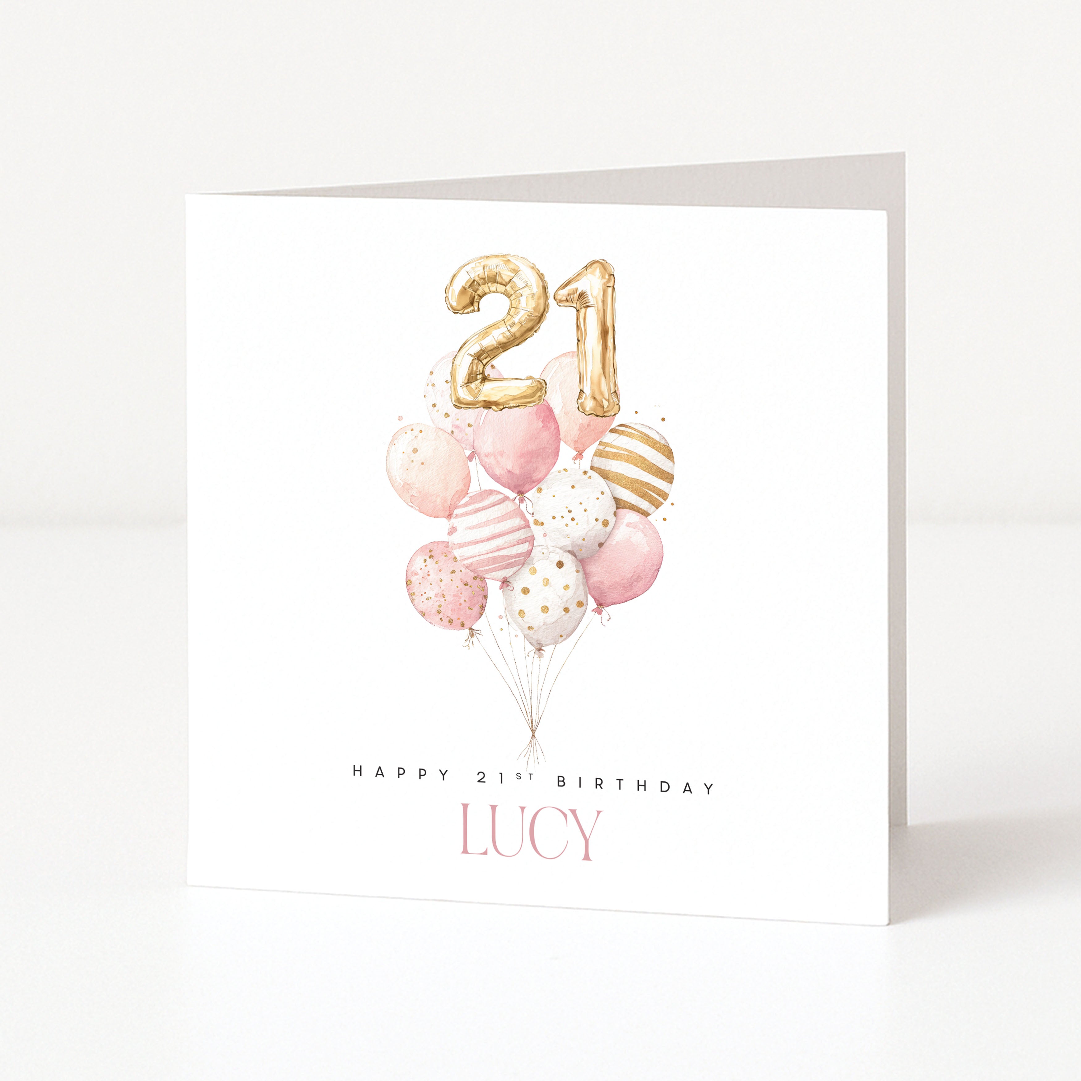 Birthday card with balloons and gold number '21' on a white background