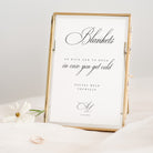 Decorative blankets sign for wedding with text in a gold frame on a white background