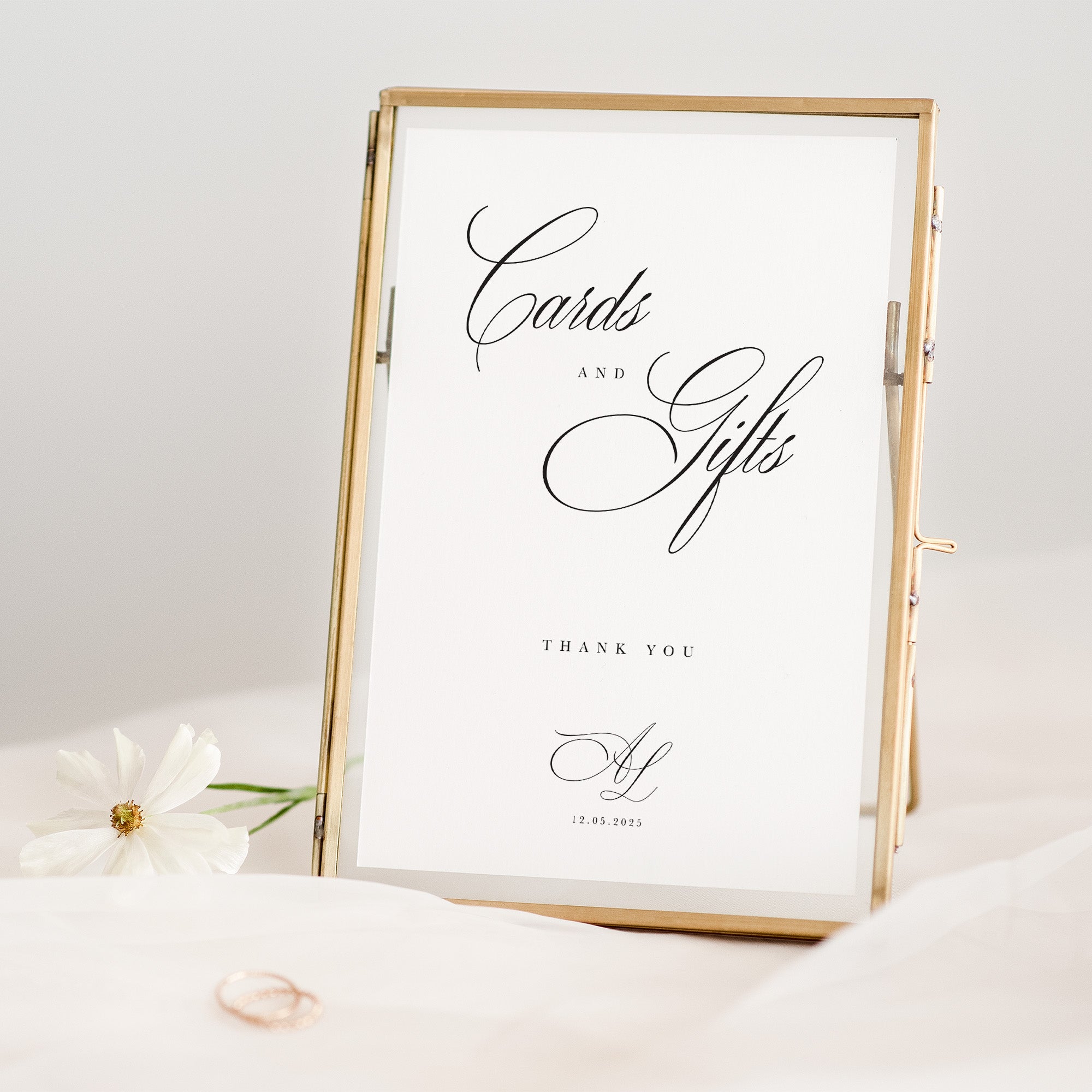 Gold-framed sign with 'Cards and Gifts' text on a white background