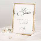 Decorative sign with 'Gents' and wedding date in a gold frame on a white background
