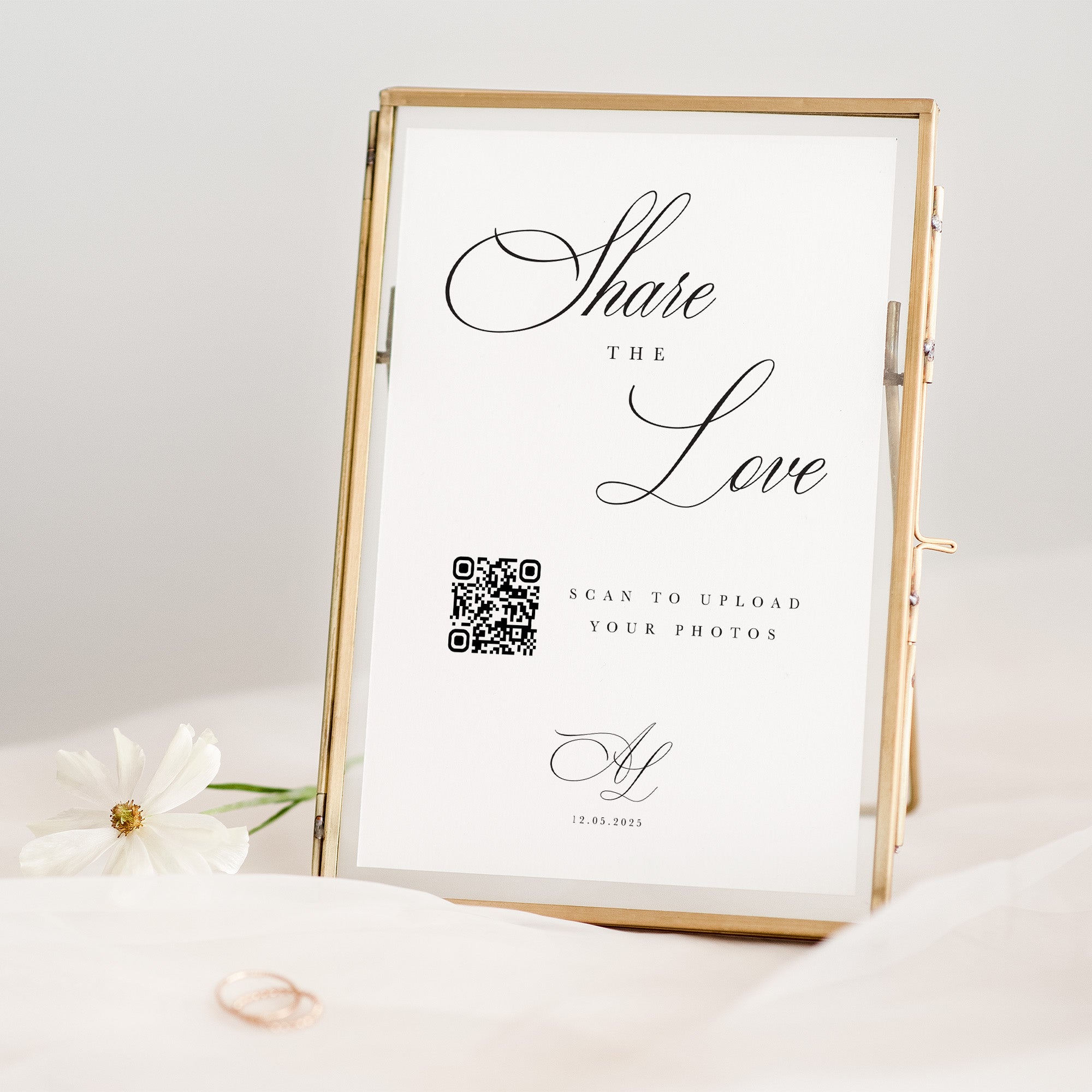 Framed print with 'Share the Love' text and QR code on a light background