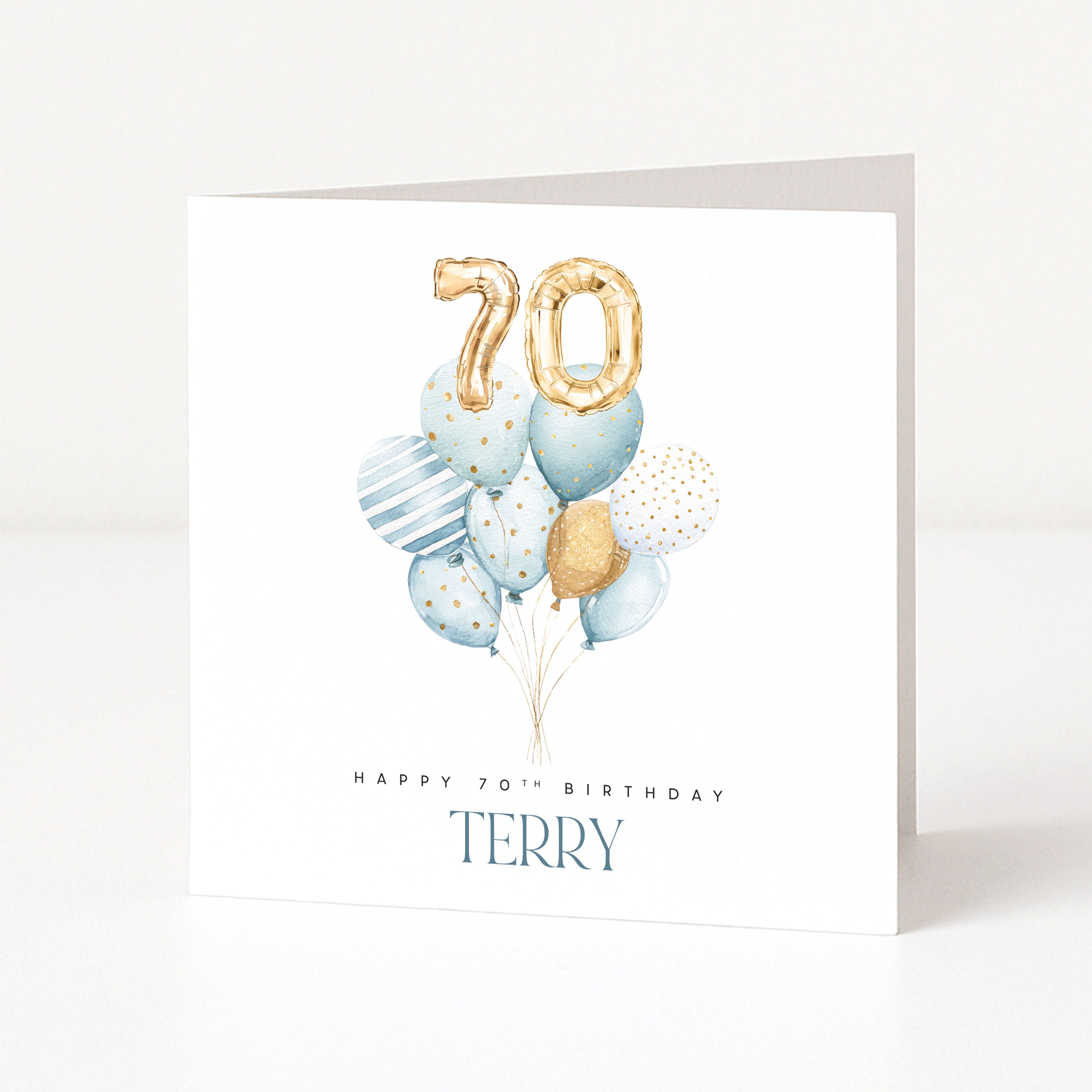 Personalised 70th birthday card for Terry with blue watercolour balloons and gold 70 number balloons.