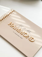 Beige Acrylic wedding guest book with caramel gold 3d lettering and UV printed black details