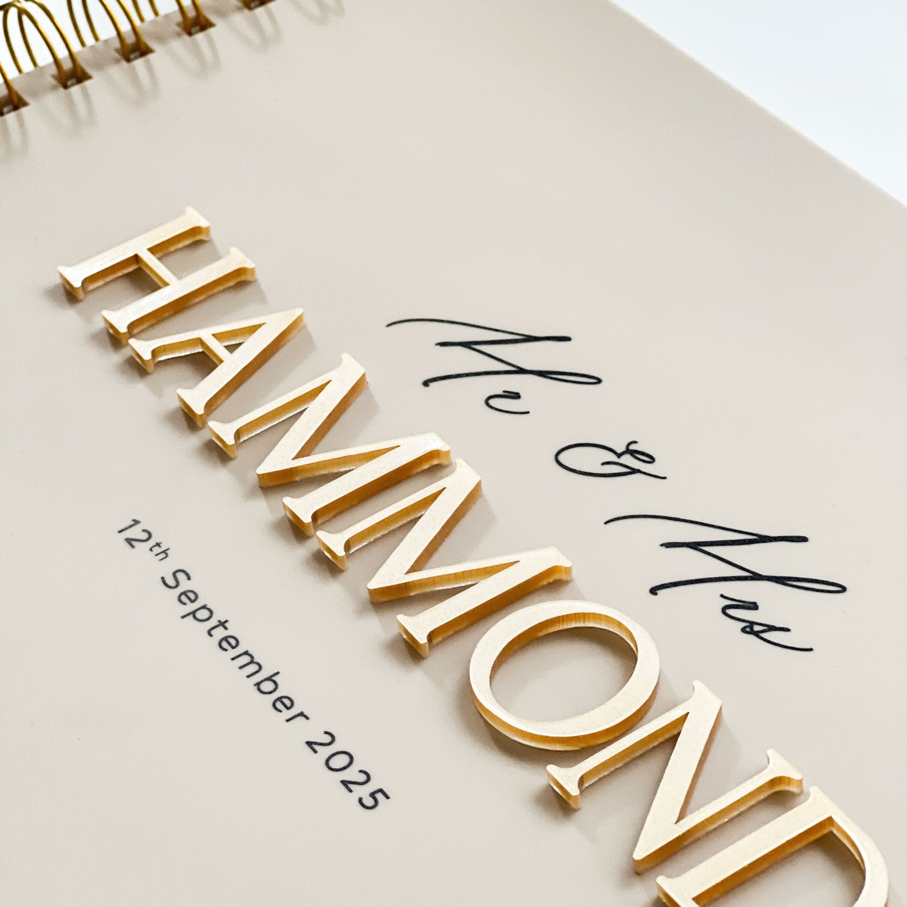 Beige Acrylic wedding guest book with caramel gold 3D lettering and UV printed black details