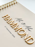 Beige Acrylic wedding guest book with caramel gold 3D lettering and UV printed black details