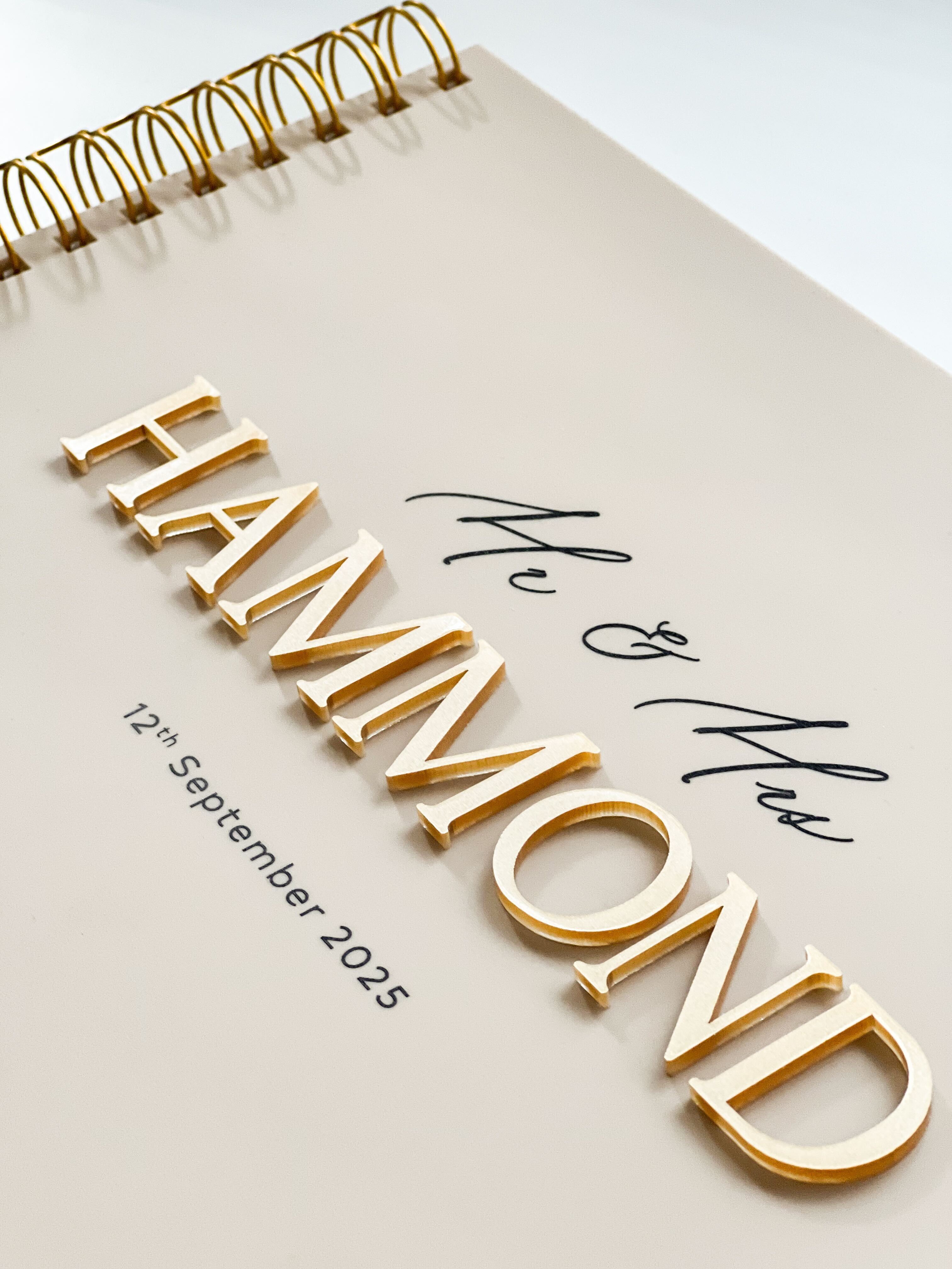 Beige Acrylic wedding guest book with caramel gold 3D lettering and UV printed black details