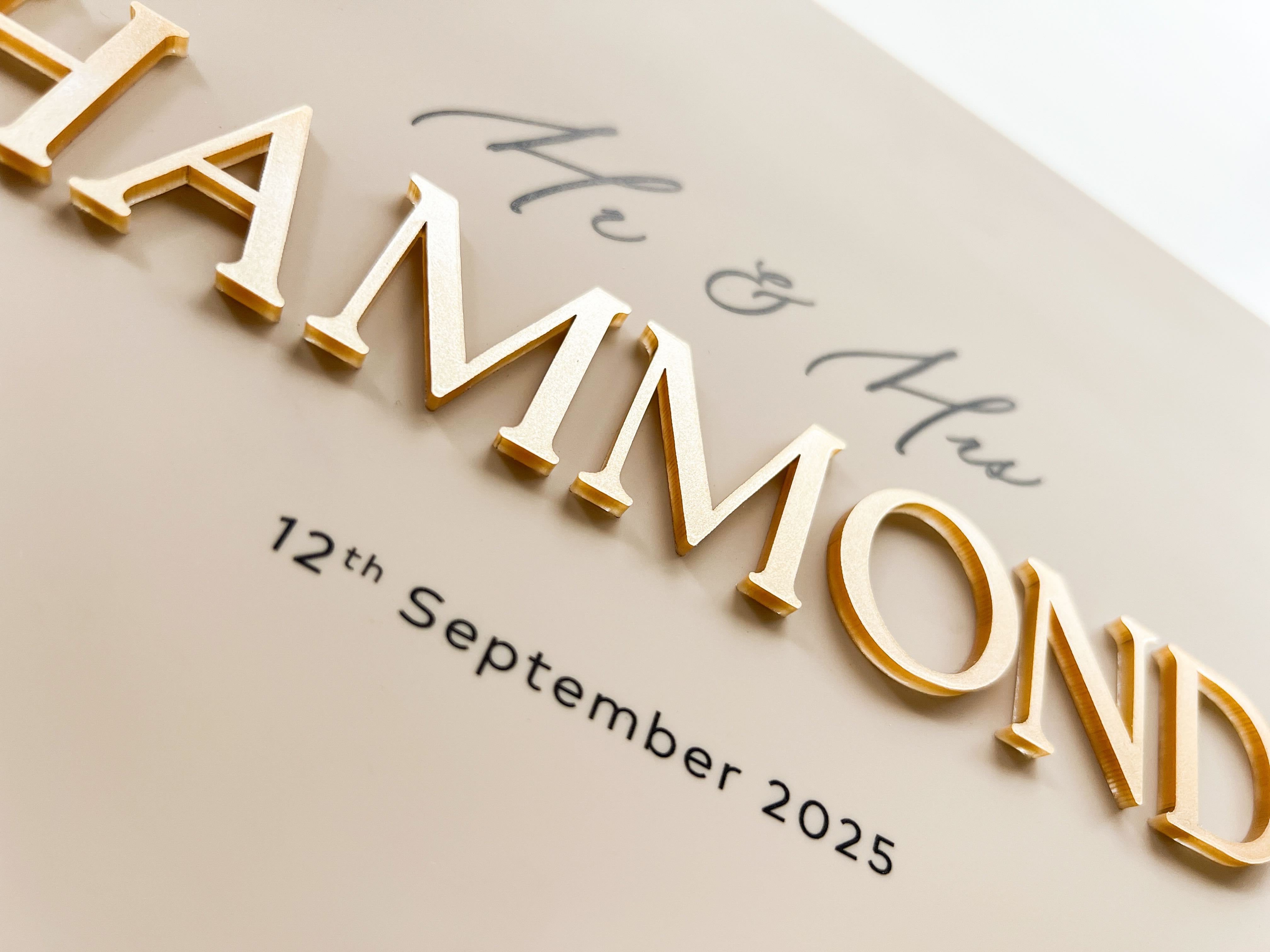 Beige Acrylic wedding guest book with caramel gold 3D lettering and UV printed black details