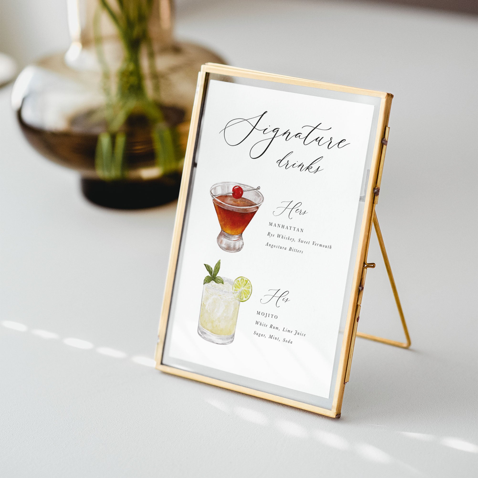 Signature drinks menu with cocktail illustrations on a white surface