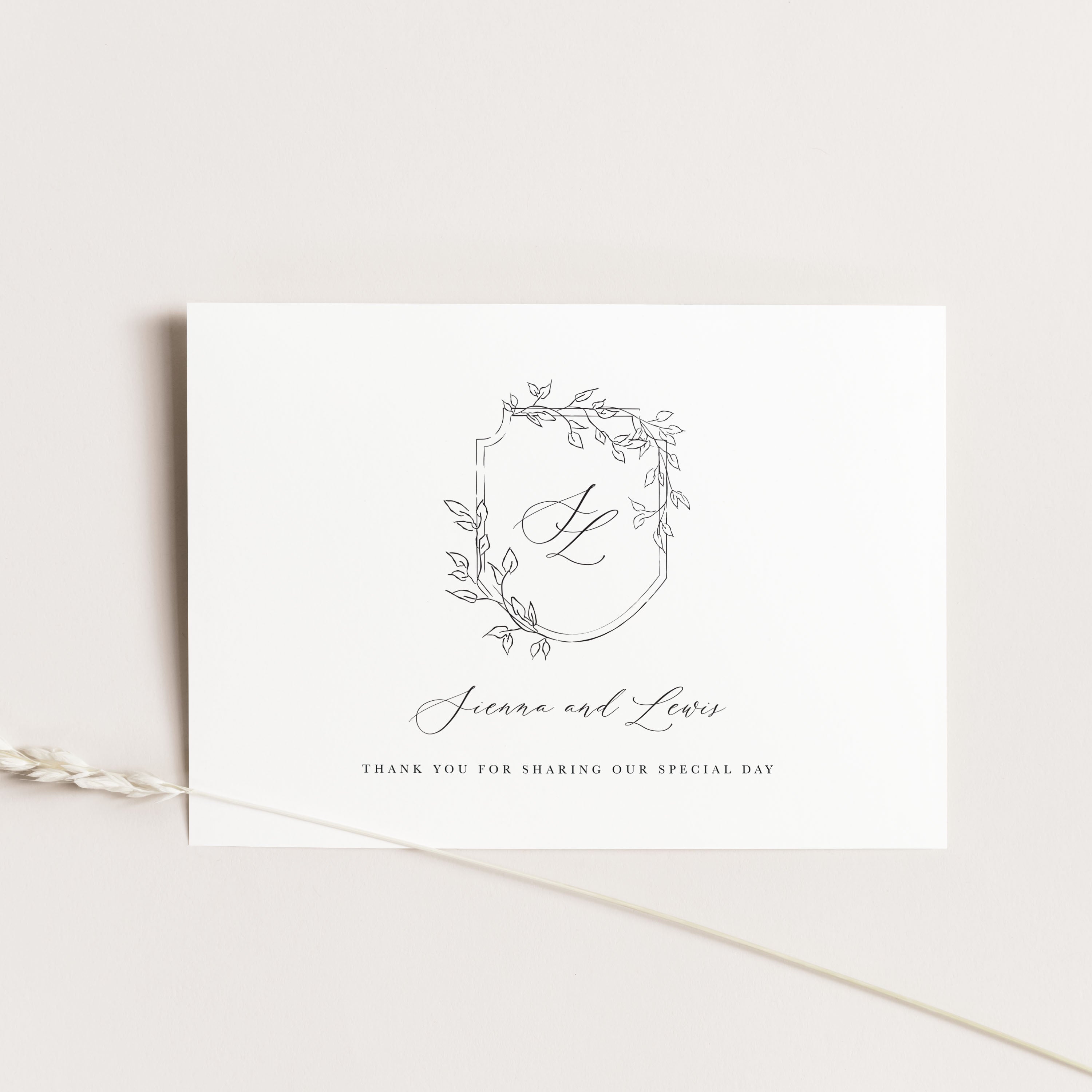 Wedding thank you card with monogram and text on a white background