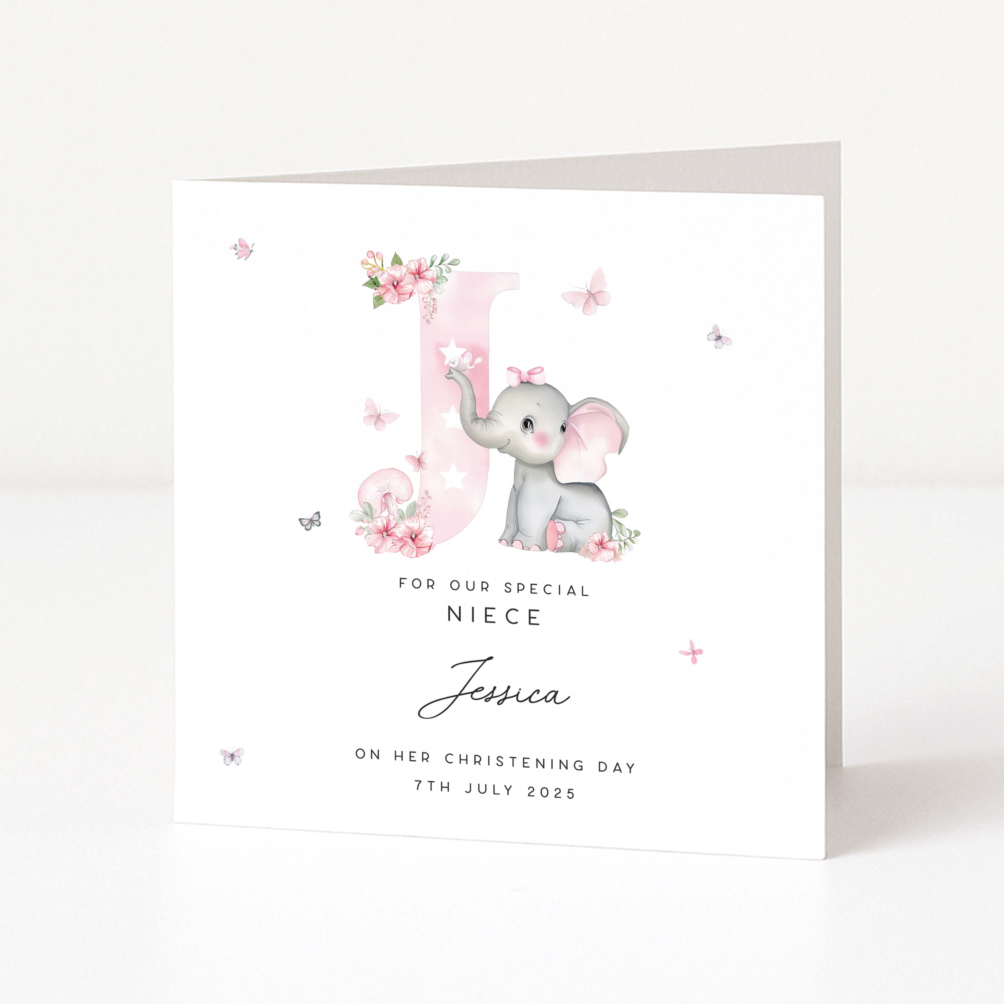 Christening card for niece with a baby elephant illustration and personalized text on a white background