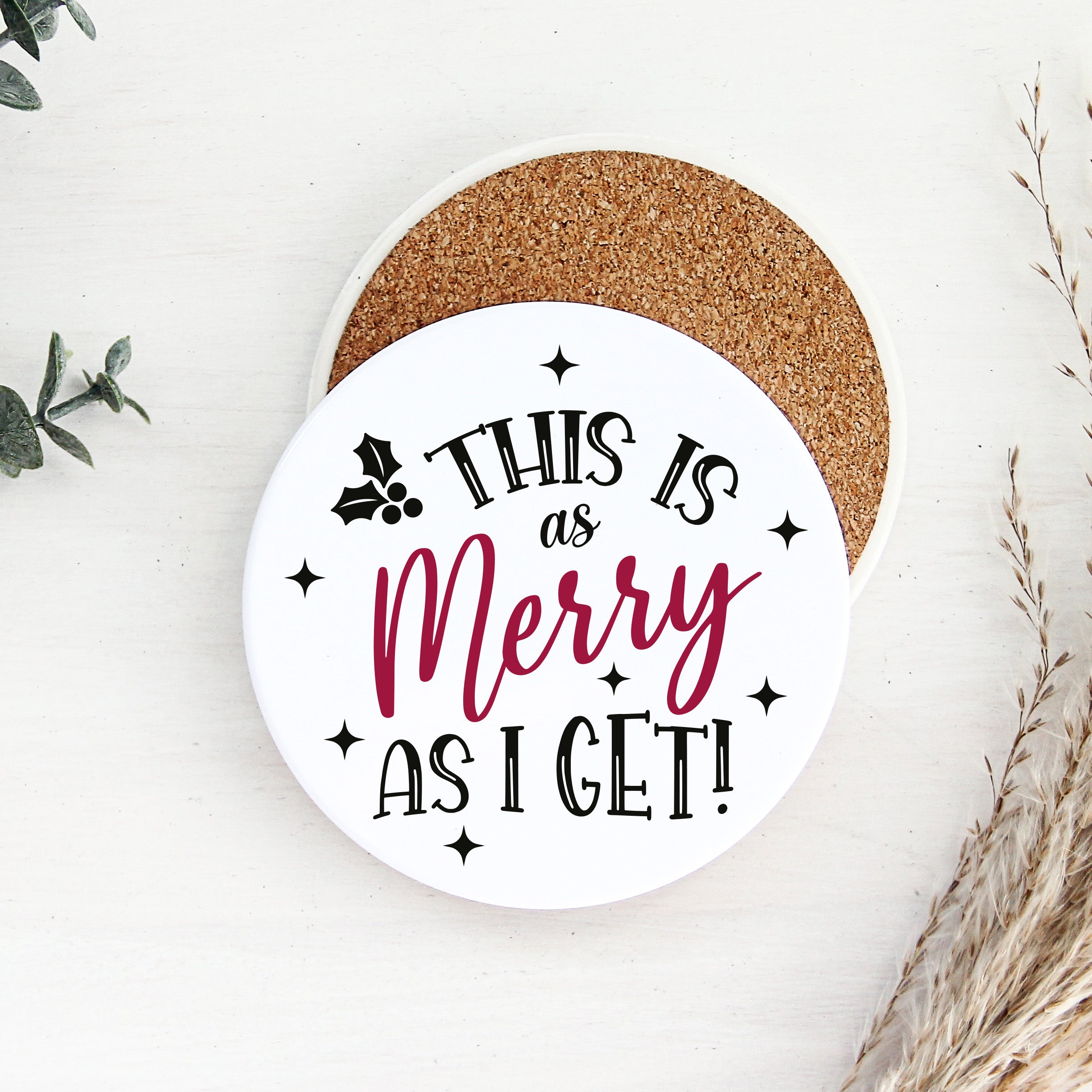 Round coaster with text 'This is as Merry as I Get!' on a white background