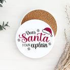 Round coaster with 'Dear Santa I can explain' text and Santa hat graphic on a white background.