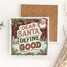 Christmas ceramic coaster with Santa Claus and text 'Dear Santa, Define Good' showing cork board on reverse of coaster