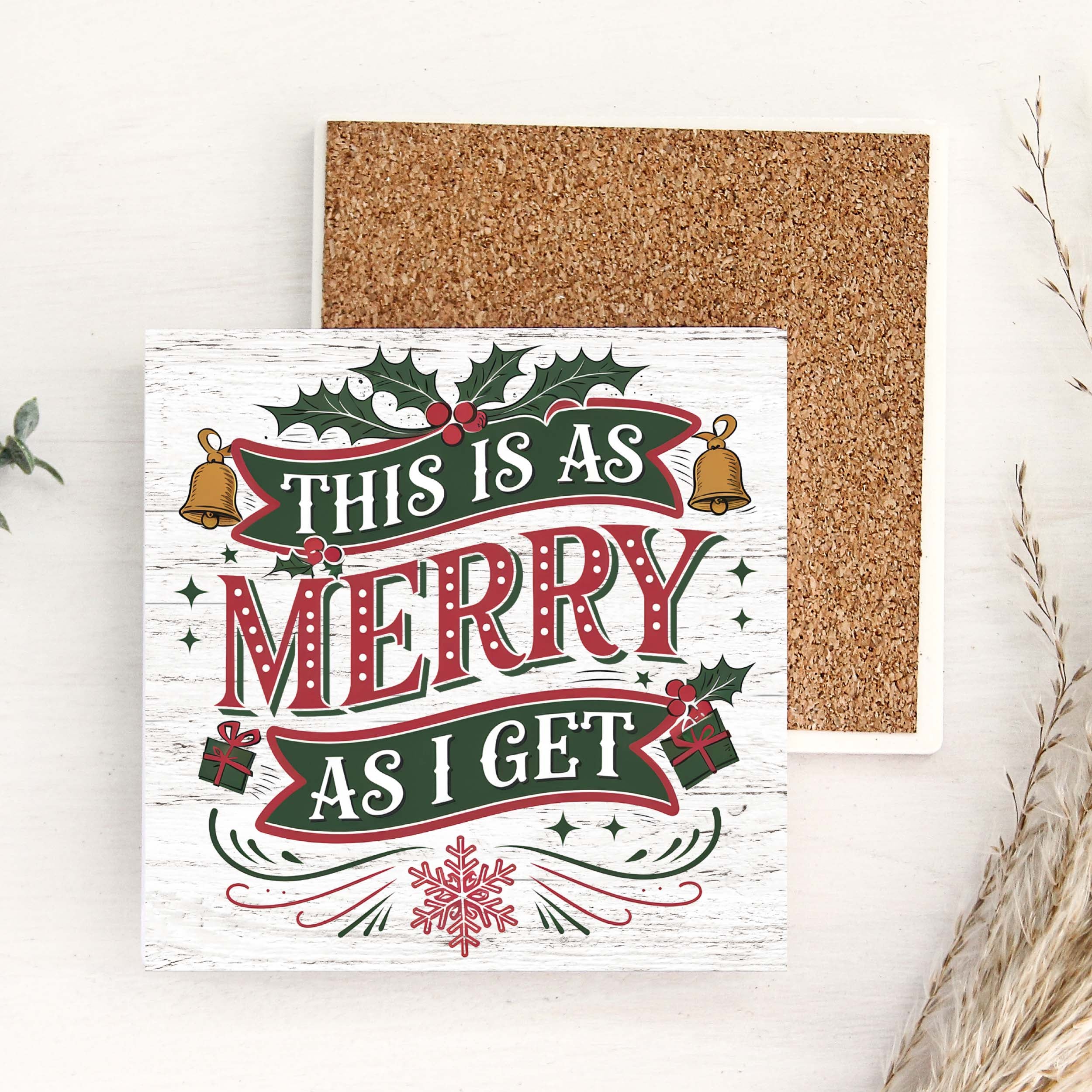 Decorative ceramic coaster with Christmas text and graphics on a white background