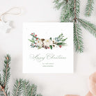 Christmas card with floral design and 'Merry Christmas' text, surrounded by pine branches.