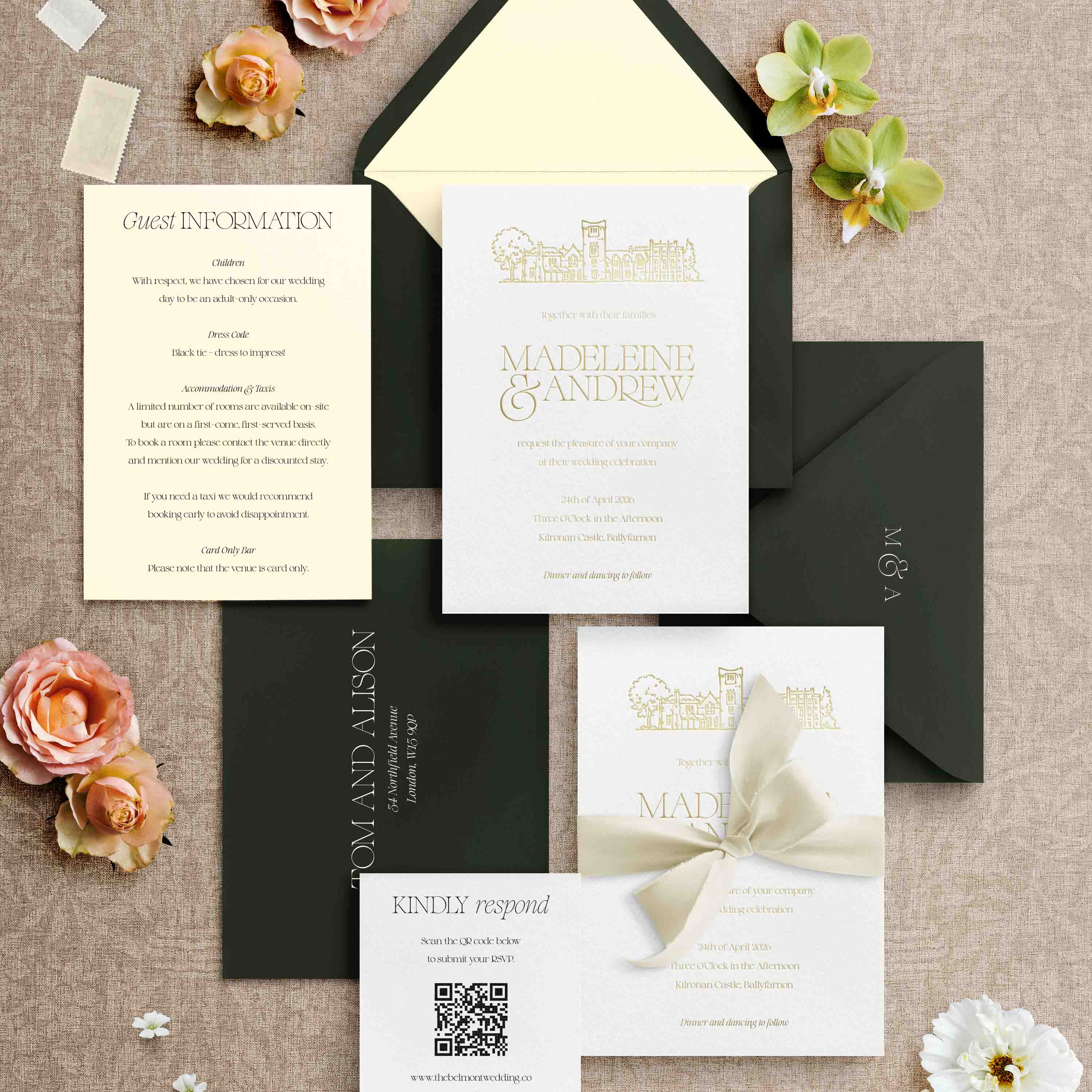 Wedding invitation set with envelopes on a textured surface with flowers.