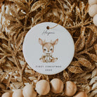 Decorative ornament with a baby deer illustration and 'First Christmas 2025' text on a gold and beige background.