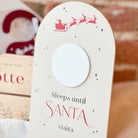 Christmas Countdown Sign with 'Sleeps until Santa visits' text and Santa Claus illustration on a white background.