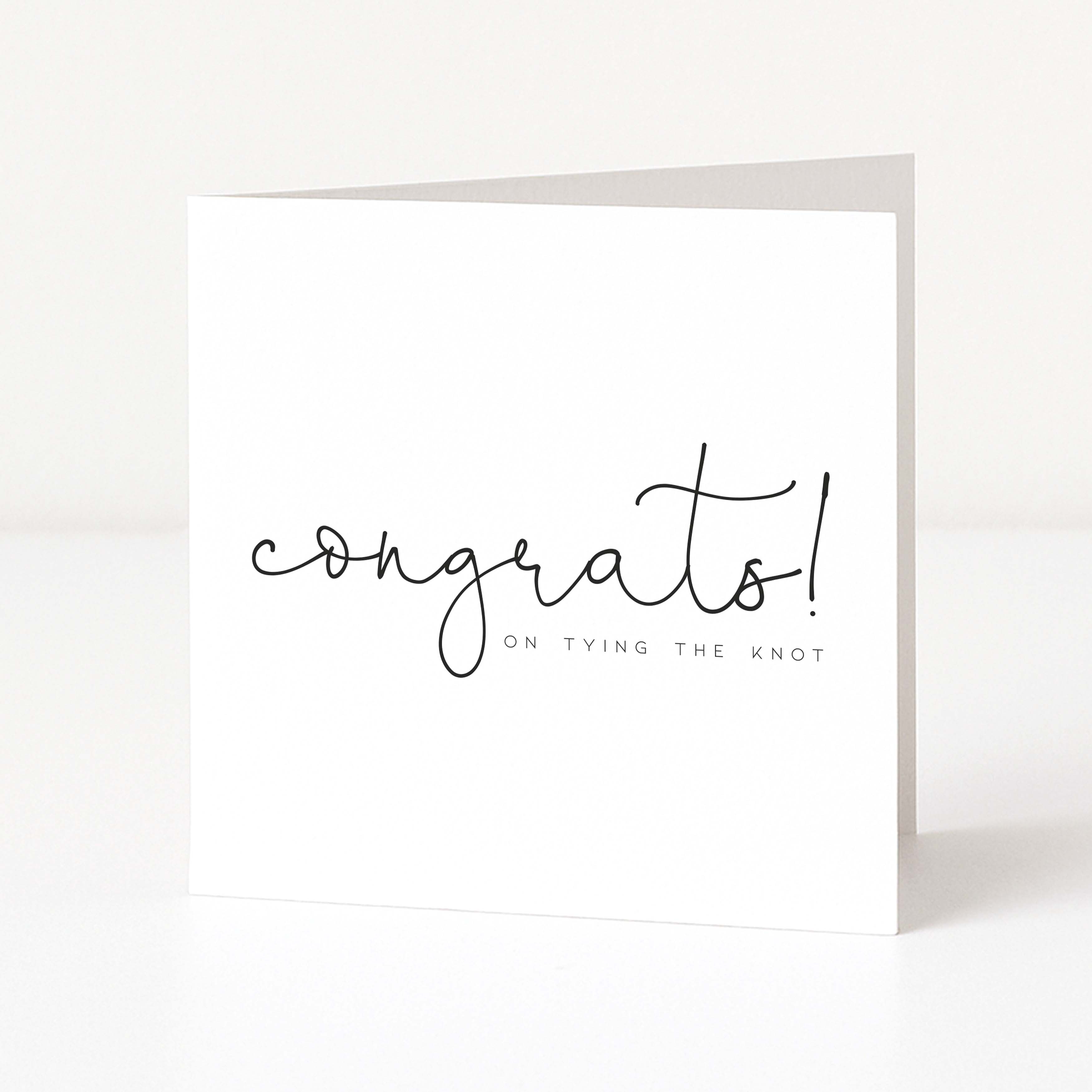 White card with 'congrats! on tying the knot' text on a white background