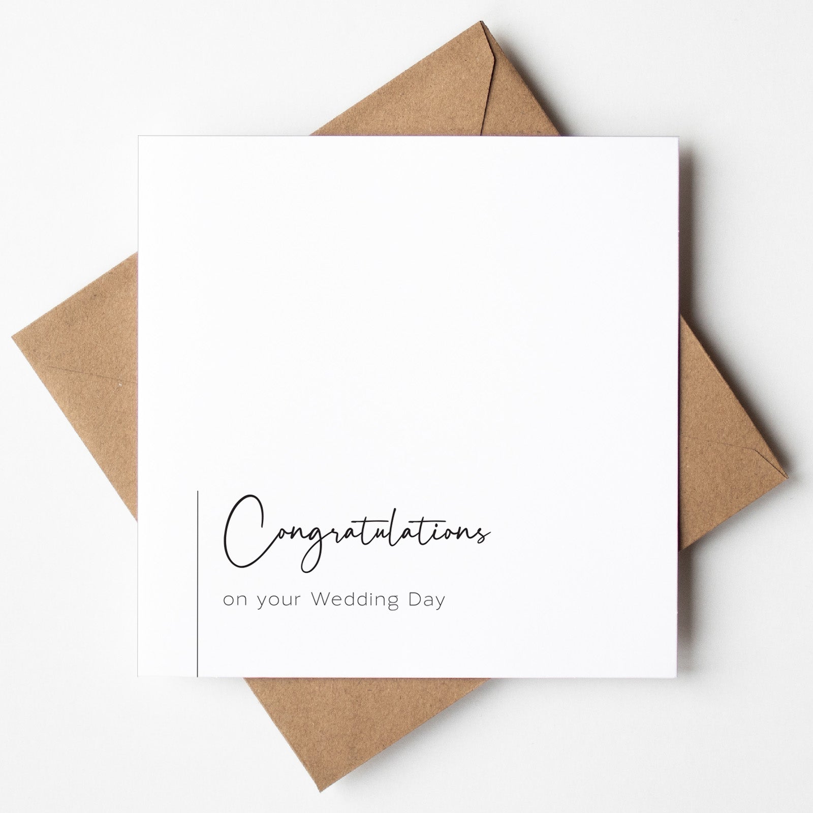 White card with 'Congratulations on your Wedding Day' text and brown envelope on a white background