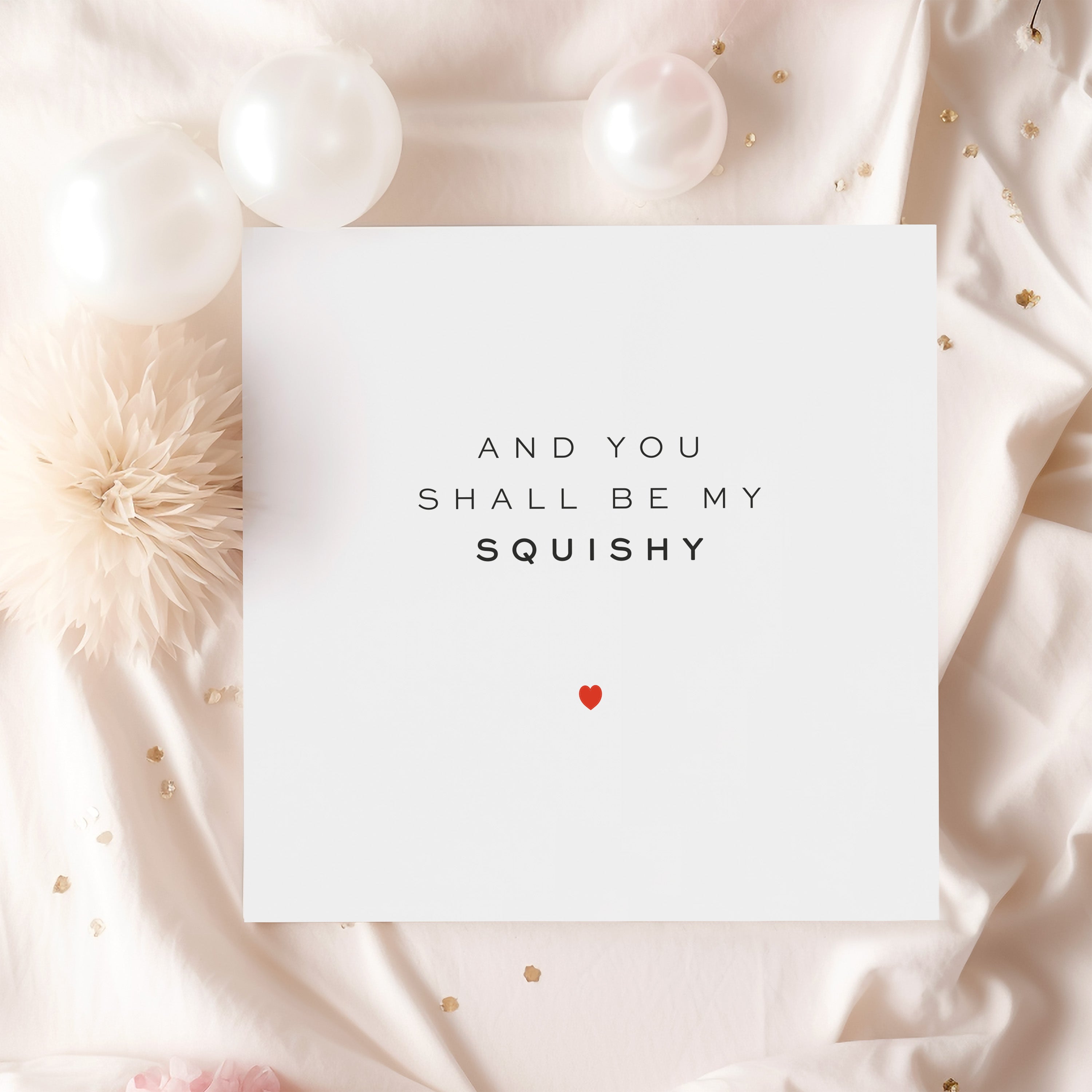 Card with 'And you shall be my squishy' text on a soft fabric background