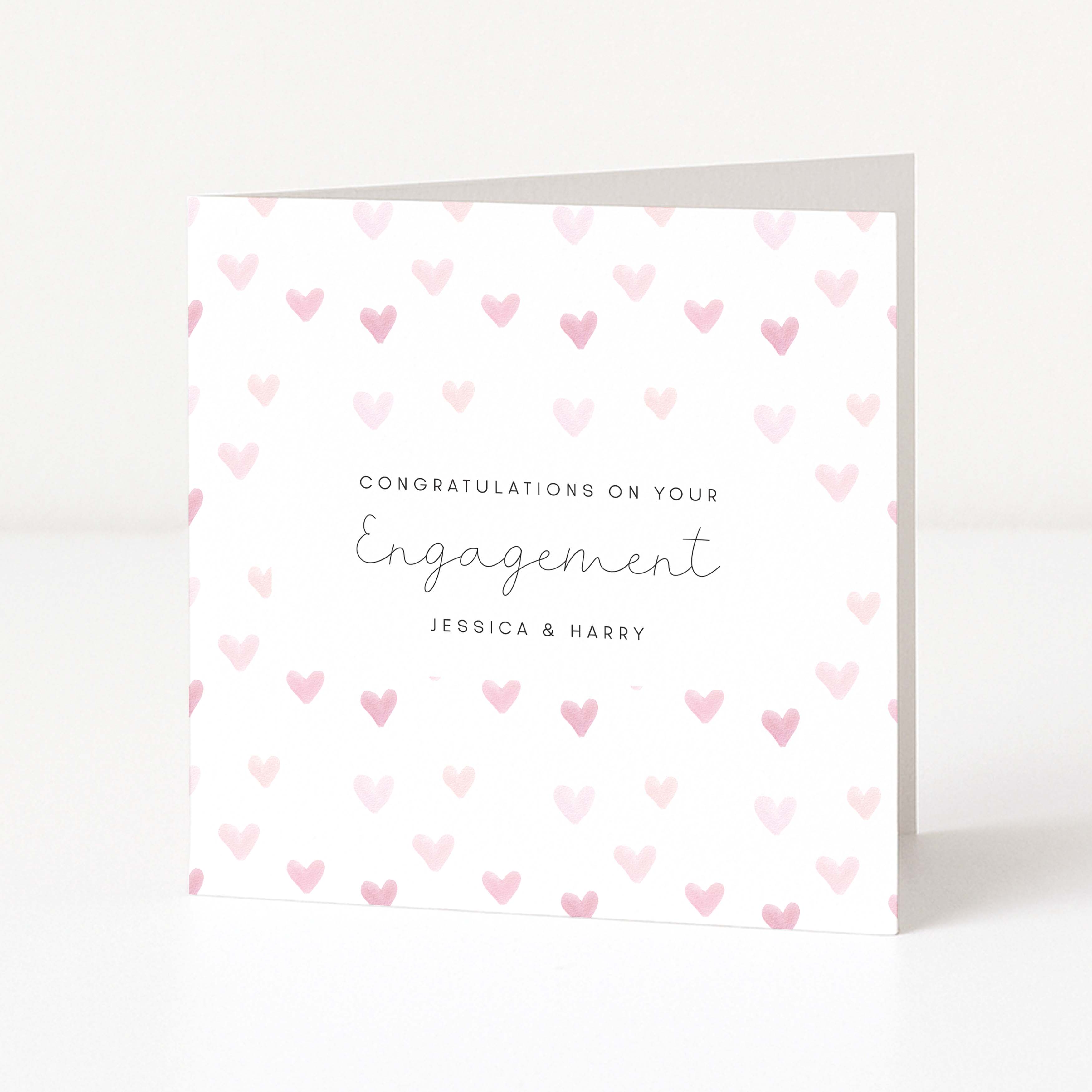 Greeting card with pink heart pattern and 'Congratulations on your Engagement' text.