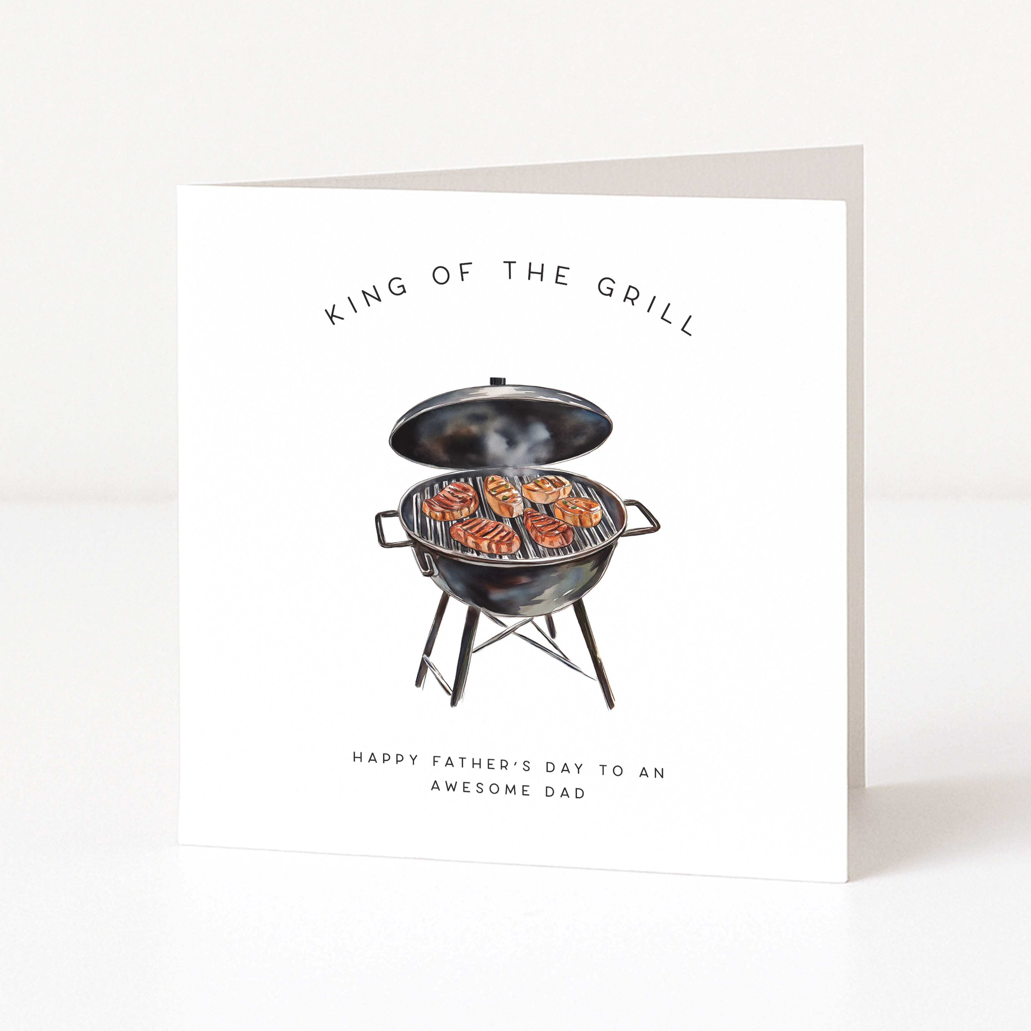 Father's Day card with illustration of a grill and text 'King of the Grill' on a white background
