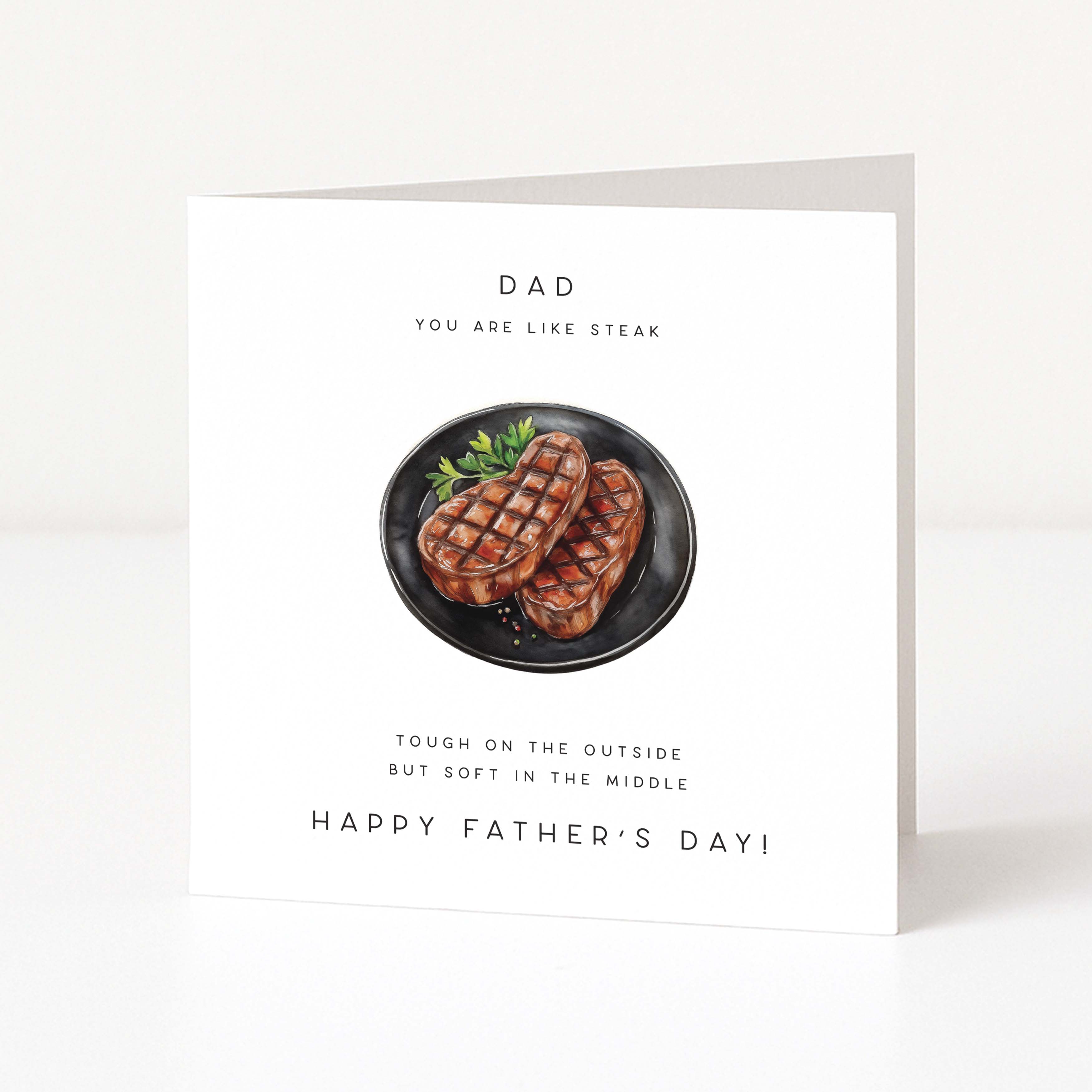 Father's Day card with a plate of steak and humorous text on a white background