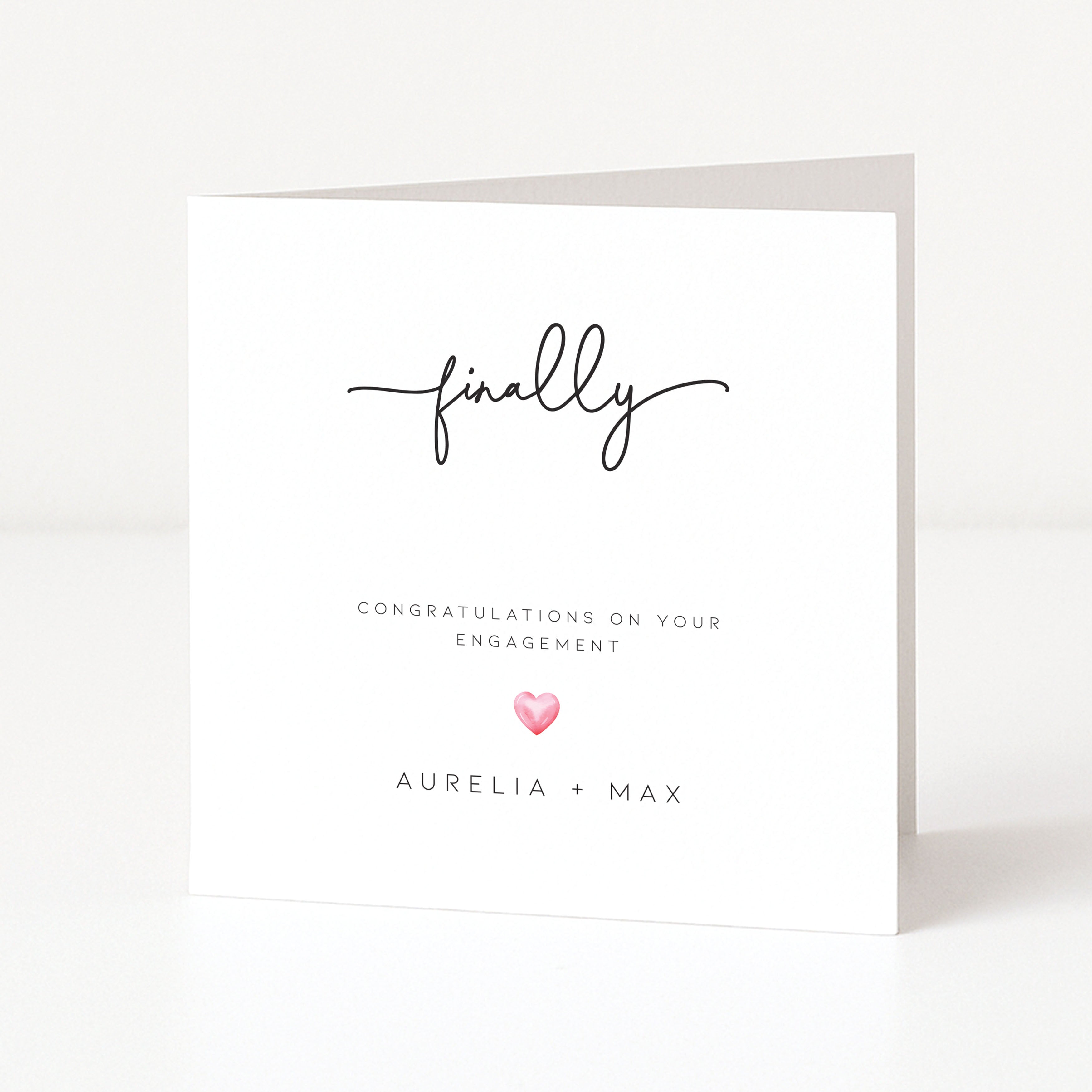 Engagement card with 'finally' and a heart on a white background